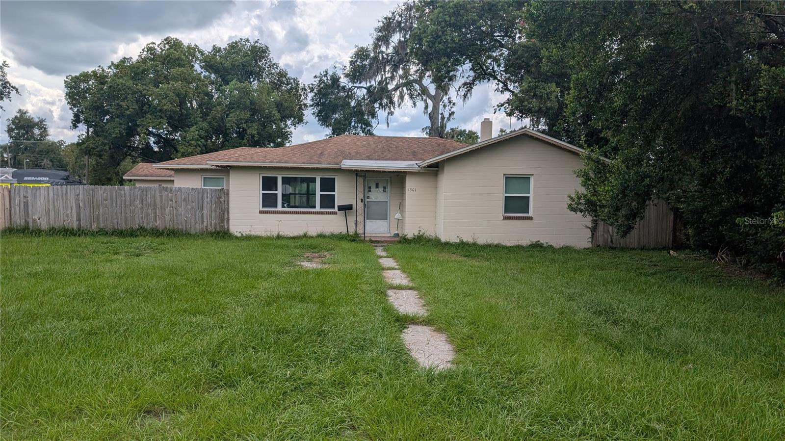 3 bedroom 1 bath, move-in ready, block home on a large lot near Downtown Plant City. Home opens into nice sized living room, all three bedrooms are on the right as you enter, as well as the bathroom. Dining room is straight ahead, and kitchen, utility, and garage are all on the left of the entrance. Large open front yard and back yard is fully fenced. Cement blocks set up for a small garden in the middle of the yard. Roof replaced in Nov. 2019. Home plumbing re-piped in 2021. Electrical rewired in 2017. A/C Handler replaced 2019. Close to I-4, downtown, shopping, public library, schools, parks, and restaurants.