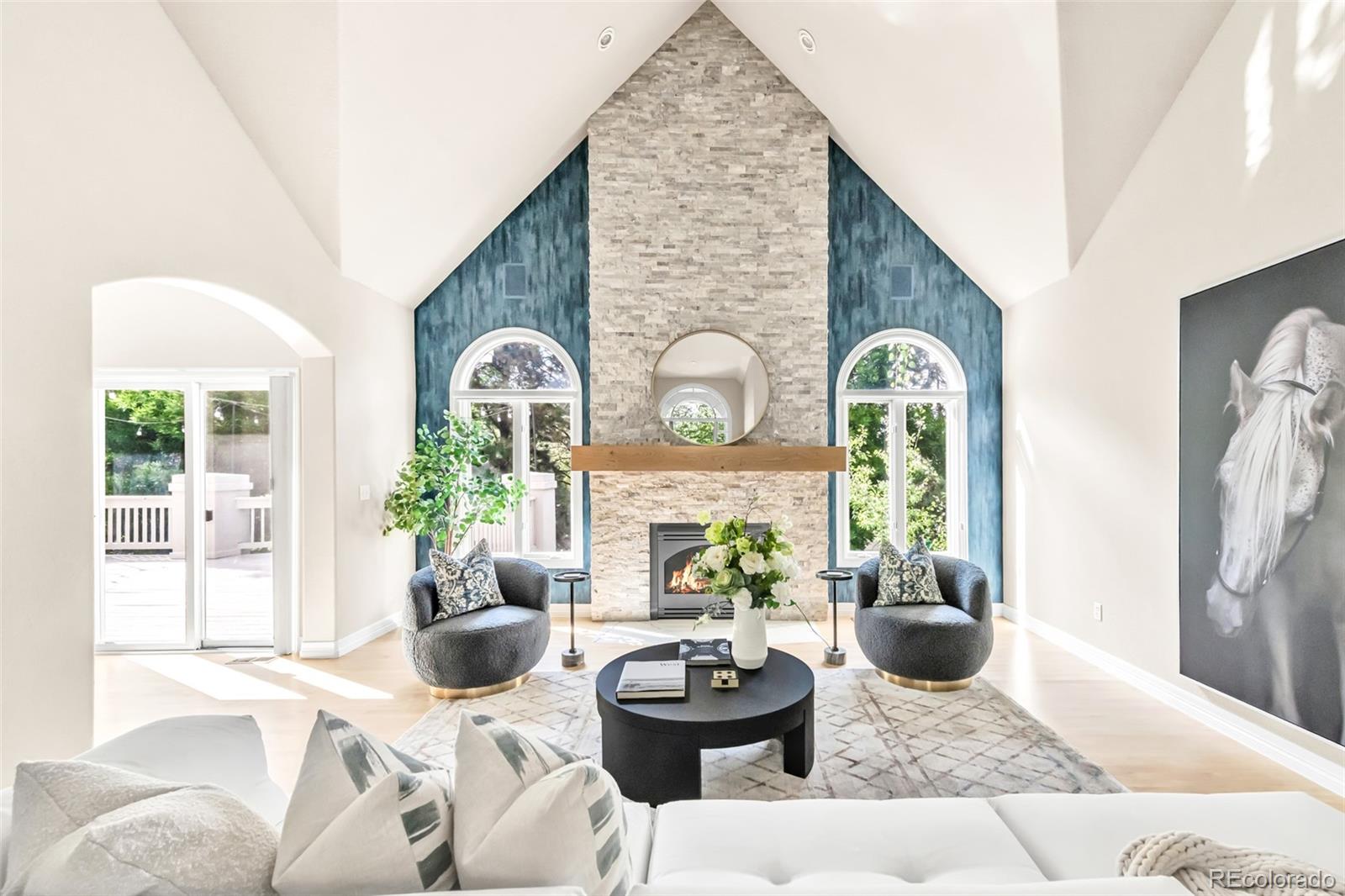 A light-filled and updated retreat awaits in this sprawling home within The Greens at Pinehurst, a coveted golf cart community. Mature trees envelop the property, creating a treehouse-like ambiance throughout. Inside, a soaring double-height entryway opens to a vaulted office with built-in storage and a formal dining room framed by bay windows. The towering great room seamlessly connects to an open-concept living, dining, and kitchen area—complete with a massive center island, sleek cabinetry, and high-end appliances. Conveniently located on the main floor, the luxe primary suite boasts a deep corner soaking tub and walk-in shower. Two large bedrooms with ensuite bathrooms and walking closets. The newly renovated basement is designed for entertaining, featuring a wet bar, theater room with an acoustically transparent screen, and walk-out access to a backyard haven. With lush landscaping, a spacious balcony, and a verdant lawn that doubles as a sledding hill in the winter, the outdoor spaces are truly an oasis. This tight-knit community enriches daily life with a vibrant calendar of events, convenient access to top-rated schools—including Colorado Academy, Denver Christian, and Mullen—and the ease of being just a golf cart ride from Pinehurst Country Club, making this home a rare offering in one of Denver’s most coveted neighborhoods.