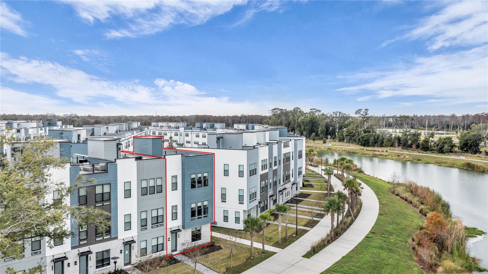 JUST LISTED!!!  BETTER THAN NEW EXQUISITE 4 LEVEL CORNER LUXURY RESIDENCE IN THE HEART OF THE VIBRANT PACKING DISTRICT! This is the sought after "Nova Modern Elite II" model by Toll Brothers offering 4 levels of living space with breathtaking elevated design featuring customized high-end finishes! Home boasts a RARE 4 BEDROOM FLOOR PLAN that is flooded with natural light resulting in a fantastic bright, open and airy feel throughout! Truly one of the nicest and best positioned residences in the community! Located in the most desirable location within "The Brix" offering a fabulous WATER AND CONSERVATION VIEW and perfectly oriented to take in the evening sunset with direct front access to several miles of walking and biking trails maintained by the City of Orlando! You will love the EXPANSIVE ROOF TOP TERRACE prepped and ready for a future 4-season kitchen, outdoor fireplace, and hot tub...a fantastic entertaining and unwinding space with incredible views....some of the nicest in the community! Home is wired for wi-fi throughout with central vacuum system on all three floors! This is the BEST OPPORTUNITY TO HIT THE MARKET in The Brix in some time due to the appointments, finishes, room count and location of this residence at the price being offered! CLICK ON VIRTUAL TOUR LINK FOR COMPREHENSIVE HAND HELD WALK THROUGH VIDEO...the video and pictures tell the story but this home must be seen in person to truly be appreciated! This is a rare opportunity to secure a custom level 4-bedroom home perfectly sited in one of DT Orlando's most dynamic new communities! The Brix is located in the eagerly anticipated Packing District which has come together and received high acclaim as one of Central Florida's most dynamic and well-planned new developments! The Packing District is a 202-acre $700-million transformational mixed-use development project located near the west side of College Park in Orlando. This home offers unbeatable "minute access" to all of these new amenities including the 33,000 sq ft YMCA, Orlando Tennis Center, Amphitheater, Foxtail Coffee, Publix, Southern Box Food Hall, 4Roots Farm, Rock-Climbing Facility, Dog Park, Arc Pet Spa and Hotel (daycare, boarding, grooming), and adjacent Dougie's Dog Bar! Easy access to all main roads/connectors, shopping centers, hospitals and more!  An absolutely unbeatable residence and Florida active lifestyle opportunity in "The City Beautiful"!