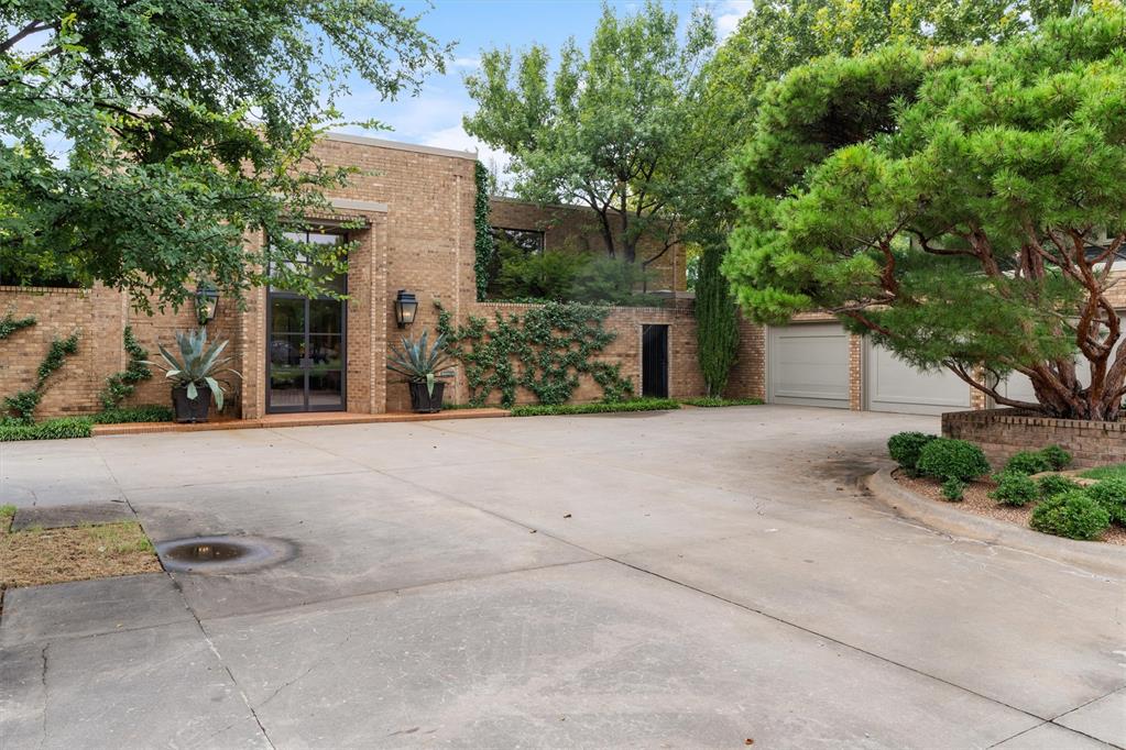This exceptional 3-bedroom, 5.5 bath Raymond Carter home is a rare find, blending timeless elegance with modern updates. Thoughtfully remodeled by Tom Krone, every detail has been designed with beauty, function, and care. Step inside to soaring ceilings, warm brick floors, and a seamless flow of light-filled living spaces. The Chef's kitchen is a dream, equipped with top-tier appliances, custom cabinetry and abundant workspace. Generous entertaining areas open to the outdoors, where a large pool and cabana create a private retreat, enhanced  by John Fluitt's signature landscaping. The home offers a 3-car garage, whole home generator, and a perfect balance of modern sophistication with traditional, casual character. Each bedroom is en-suite, and every inch of the estate reflects quality craftsmanship and meticulous maintenance. The Nichols Hills residence is truly one of a kind-designed for both comfortable living and unforgettable entertaining.