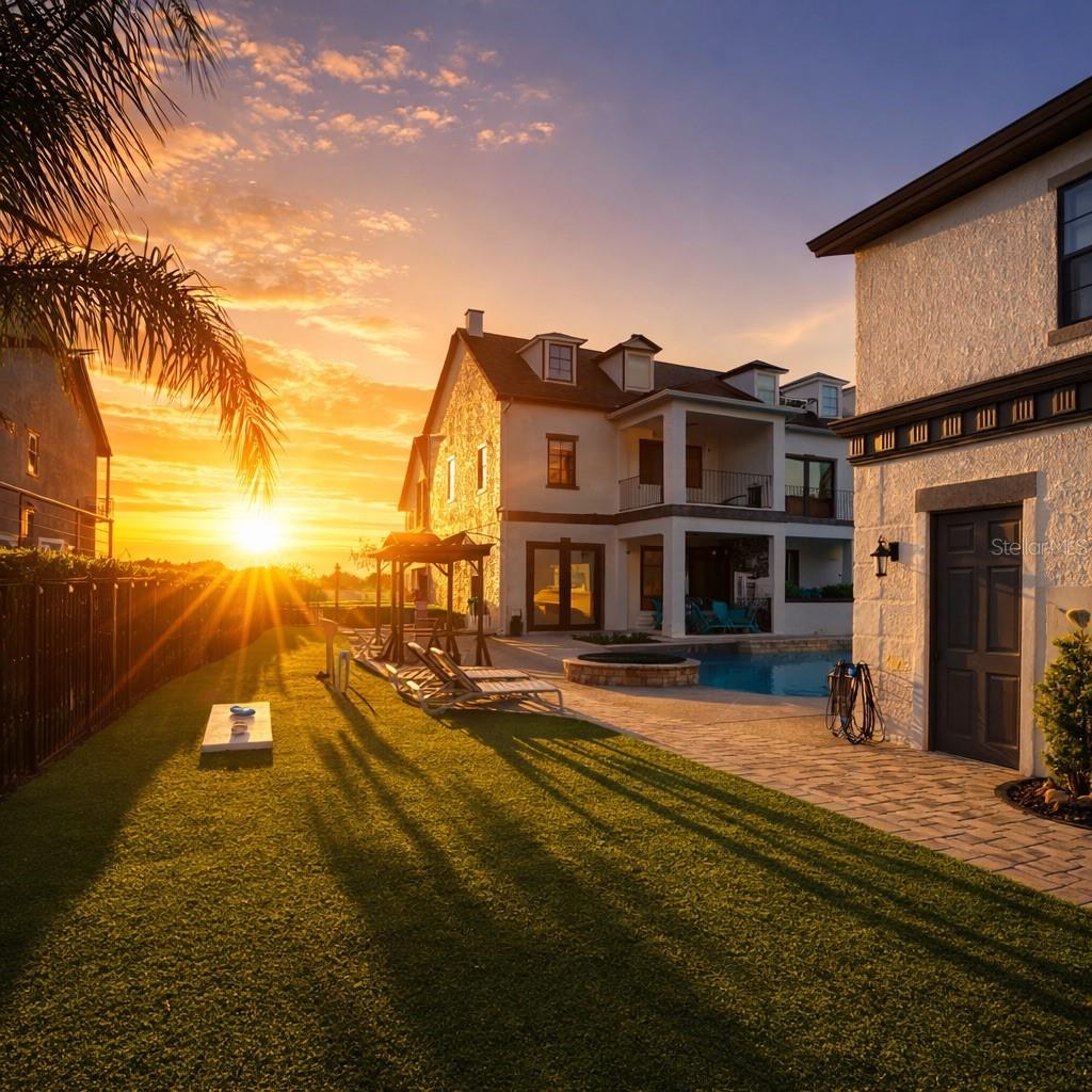 Luxury, Lifestyle and Legacy- The best parts of owning, living and vacationing in Reunion are on display at this Sunset Stunner!  Welcome to 1536 Corolla Court in the heart of Reunion’s Liberty Bluff Community.  This is A RARE 3 STORY HOME that showcases the “POSTCARD VIEW” from multiple balconies and allows you to overlook 7 HOLES of GOLF!  The property is also WEST facing which means you will never miss another Reunion Sunset again!  Take note that the lot is larger than normal which allows for more entertaining and outdoor area.  High-end artificial turf has been installed to maximize the space.  Along with an outdoor cooking area, a freshly painted pool deck and a multiple lounging chairs-this home is a sun worshipers dream!  This type of construction and layout will make you feel like you are getting 2 properties for the price of one.  Inside the first property you will find a fully equipped fun zone on the first floor filled with high-end gaming systems.  There is a private entrance just for the first floor and it is walls are lined with 2 sets of French doors that let you overlook the pool area.  A custom feature in this home.  The second floor also has a private entrance.  There you will find a well-appointed space with 2 bedrooms along with a kitchenette and a separate bathroom area.  Once inside the main house you will be drawn into how much natural light is inside.  The paint tones and colors have been chosen to create a calm and relaxed feeling. The open floor plan includes an indoor and outdoor dining space, a spacious kitchen and a comfortable living room all on the first floor.  You will also find a FIRST FLOOR BEDROOM with a private bath. There is also a separate ½ bath that doubles for a pool bath.  You can access the second floor via the wood tread staircase or take your own PRIVATE ELEVATOR.  There you will find additional bedrooms, with large private balconies along with a STAR WARS themed bedroom with bunkbeds.  The THIRD FLOOR is reserved for the primary bedroom and includes its own special oversized covered outdoor balcony designated for a cup of morning coffee or an evening glass of wine. You can also see the Reunion Grande Hotel in the distance. THIS PROPERTY HAS IT ALL!  This home does come with an ACTIVE REUNION RESORT MEMBERSHIP and is in a very active and SUCCESSFUL rental program. HUGE RENTAL AND MEMORY MAKING POTENTIAL. Reunion Resort has everything you want in a community including 3 signature golf courses, world class dining, waterparks, lazy river, water slides, firework viewing areas, tree lined streets, dog park, playground, driving range, golf simulator, member events, in-resort shuttle service, and event space. Live the resort lifestyle like a VIP. NO OTHER RESORT IN THE AREA HAS THIS!!!! Minutes to Disney and close to Beaches, Universal, Legoland and Sea World. Schedule a tour today. 80 million visitors are estimated to visit Orlando in 2026.  Welcome your family and friends in this home for years to come or take advantage of the demand for a rental home like this!  BOOKINGS ALREADY IN PLACE FOR 2026!