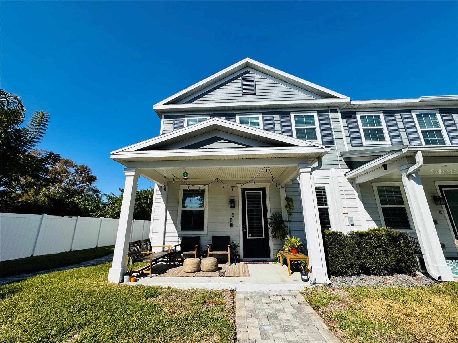 Welcome to Camellia Square, ideally situated in beautiful South Tampa! Follow the charming community walkway to this light-filled, end-unit townhome featuring a paver-lined entrance, covered front porch, and inviting foyer. From the moment you step inside, the 9-foot ceilings, abundant windows, and natural light create a warm and welcoming atmosphere. The open-concept main level is perfect for everyday living and entertaining, offering a spacious kitchen with granite countertops, a large island breakfast bar, 42-inch shaker-style cabinetry, and stainless steel appliances including the refrigerator. The kitchen flows seamlessly into the dining area and living room, which is highlighted by a stunning, custom-designed entertainment wall—a truly unique feature not found in other units. This beautiful custom addition offers generous storage, built-in pet crates with removable doors, and ample space for a large television, making it both functional and eye-catching. Upstairs, the home continues to impress with 9-foot ceilings throughout. The expansive primary suite features a walk-in closet and a well-appointed en-suite bath with double vanities and a frameless glass shower. The second and third bedrooms, each with walk-in closets, are connected by a convenient Jack- and-Jill bathroom. A full laundry area is also located on the upper level for added ease. A rare luxury for townhome living, this home includes a two-car garage with additional space for storage. As an end unit, it offers enhanced privacy along with extra windows that bring in fresh air and beautiful natural light throughout the day. The friendly next-door neighbor, proximity to the community dog wash station, and thoughtfully designed layout all add to the exceptional livability of this home. All appliances are up to date and have been meticulously maintained. The HVAC system has been professionally serviced by a trusted local company, the heater works great, and the home is equipped with fire and CO2 alarms. There have been no plumbing or electrical issues, reflecting the pride of ownership throughout. Camellia Square offers amenities for outdoor entertaining and a designated area for furry friends, and is conveniently located near Tampa International Airport, Downtown Tampa, MacDill AFB, I-275, the Crosstown, Veterans Expressway, and easy access to Pinellas County. This home has been truly loved and cared for, and while moving on is bittersweet, it presents a wonderful opportunity for the next owner to enjoy everything it has to offer. Schedule your private tour and welcome home!