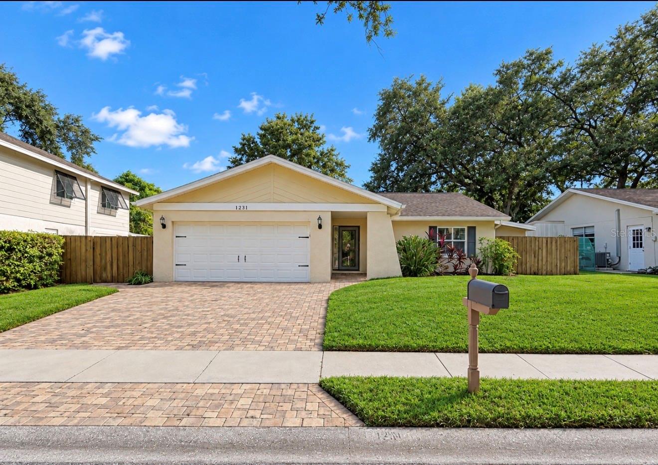 WELCOME HOME! SPACE, STYLE, COMFORT & AN EXCEPTIONAL LARGO LOCATION! Beautifully maintained 3-bedroom, 2-bathroom, 2-car garage home nestled in an established neighborhood near the Largo Recreation Center and just a short stroll from the entrance park pathways! Enjoy morning walks, outdoor recreation, and the convenience of nearby recreation family sports center. From the moment you arrive, the attractive paver driveway, lush landscaping, and inviting curb appeal showcase the pride of ownership found throughout this exceptional property! STEP INSIDE AND FALL IN LOVE with the spacious, thoughtfully designed split-bedroom floor plan offering an inviting open layout, abundant natural light, and tasteful updates throughout. The beautifully updated kitchen features gorgeous granite countertops, attractive cabinetry, and a breakfast bar highlighted by a skylight that fills the space with natural light. Beautiful LUXURY VINYL PLANK FLOORING INSTALLED IN 2022 flows throughout the main living areas, complemented by tile flooring in the kitchen and bathrooms. Double pane windows throughout the home. ONE OF THE MOST IMPRESSIVE FEATURES is the expansive rear family room, INCLUDED IN THE HOME'S TOTAL SQUARE FOOTAGE! Soaring cathedral ceilings and a beautiful WOOD-BURNING FIREPLACE create the perfect atmosphere for entertaining, family gatherings, or relaxing beside a cozy fire on those cooler Florida evenings. THE SPACIOUS PRIMARY SUITE IS A PRIVATE RETREAT, featuring incredible WALK-IN CLOSETS! The updated ensuite bathroom offers a generous walk-in shower, double-sink vanity, and convenient linen closet. Two additional generously sized bedrooms and a full guest bathroom are situated on the opposite side of the home, offering comfort and privacy for family and guests. IMPORTANT UPDATES & IMPROVEMENTS INCLUDE: TWO SEPARATE A/C SYSTEMS consisting of a 2-TON UNIT INSTALLED IN 2023 and a 2.5-TON UNIT INSTALLED IN 2014, both reported to be operating wonderfully! Additional improvements include a SHINGLE ROOF REPLACED IN 2018, NEW WATER SOFTENER IN 2025, and RIDGE VENTS WITH ADDITIONAL ATTIC FANS INSTALLED IN 2025 for improved attic ventilation. These valuable upgrades reflect the continued care and attention this home has received! LOVE OUTDOOR LIVING? Step through the dining room sliding glass doors or rear entrance to discover a wonderful COVERED OUTDOOR DECK, ideal for grilling, entertaining friends, enjoying your morning coffee, or simply unwinding in the beautiful Florida weather. A generously sized storage shed offers additional space for lawn equipment, tools, and recreational belongings. The clean, well-maintained TWO-CAR GARAGE provides ample parking, storage, and a convenient washer and dryer area. THIS HOME TRULY HAS SO MUCH TO OFFER! With its spacious layout, beautiful updates, inviting indoor and outdoor living areas, and fantastic location near Largo's recreational amenities, this is an opportunity you won't want to miss! Make wonderful memories and enjoy everything this exceptional property has to offer. SCHEDULE YOUR PRIVATE SHOWING TODAY! All property details, measurements, square footage, ages of components, improvements, and included items are believed accurate but are not guaranteed. Buyers are encouraged to independently verify all information and perform any inspections they deem necessary.