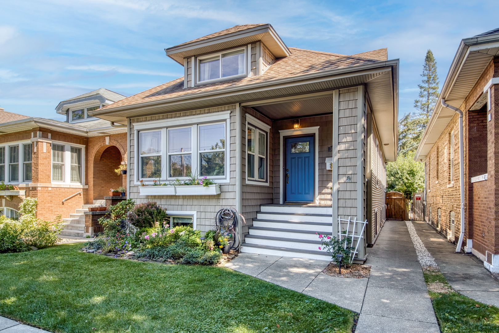 Lovely, updated 3- bedroom, 3 full bath bungalow plus office/flex room with beautiful garden and fenced private backyard in historic North Mayfair.    Located on a friendly, community-oriented block, designated as a Historic Bungalow district steps from Gompers Park and Forest Preserve bike and hiking trails!    The front door opens onto a large, sunny living room with an adjacent dining area.  Continue to the recently renovated eat-in kitchen with quartz counters and all new stainless appliances; including an induction stovetop and LG door-in-door refrigerator with craft-cocktail ice maker.   The first floor also includes a remodeled full bath and bedroom (now serving as an office) with large windows looking onto the back yard.   Upstairs is entirely devoted to the owners retreat centered around a large bedroom illuminated by a skylight and accent windows and bookended by a yoga/meditation area on one side, a walk-in closet on the other and a full Jacuzzi bathroom with separate shower adjacent.   Belowdecks you will find an entertainment room, the third bedroom and full bath, a flex room (currently utilized as a home office), and a laundry room with new stainless Samsung washer and steam dryer, as well as extra storage and work space.     The home also features an alley-access 2-car garage and recently upgraded HVAC and water heater.