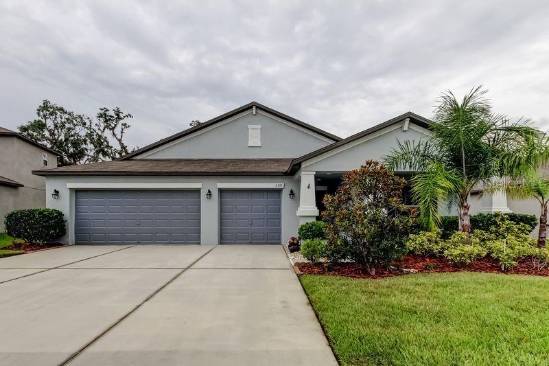 Welcome to a pristine 2019-built home nestled in the vibrant Silverado Ranch community of Zephyrhills. This beautifully maintained residence offers a perfect blend of modern comfort and energy-efficient upgrades and recently painted exterior!   You will love the open-concept design of this beautiful one-story home. The Santa Fe floorplan expands to 2,576 square feet and features a 3-car garage, 4 spacious bedrooms and 3 bathrooms with the 3rd Bedroom has on suit bathroom. The main living area boasts an exquisite open-concept space for cooking, dining and entertaining guests. From the main living space, enter the master suite to find a beautifully designed space featuring a large bathroom with separate sinks and an oversized walk-in closet. The kitchen features 36" Staggered Andover Nutmeg raised square panel cabinetry, stainless steel appliances along with granite countertops. 18x18 Baja Tecate ceramic tile completes the look. Silverado offers great amenities for those who love to meet new friends and spend time outdoors. You can enjoy a cool dip in the resort-style pool on a warm summer day, let your pups frolic at the dog park, and tire out the kiddos at the tot lot. Located in the desirable Silverado Ranch community in Zephyrhills, FL, you'll appreciate the balance of peaceful living and accessibility to local amenities such as a community pool. This wonderful home is ready and waiting for its new owners. Don’t miss this opportunity to own a beautiful, practical home in a fantastic location. Schedule your visit today and take the first step towards making it yours! The nearby schools include West Zephyrhills Elementary School, Raymond Stewart Middle School, and Zephyrhills High School. Silverado Community is know for low fees, the HOA is only $60 a month! This home is only 5 minutes from the Sara Van Berg Tennis Center (say hello pickleball evenings), twenty minutes from the Tampa Outlets, about 7 minutes from the Epperson Lagoon, thirty minutes from Downtown Tampa, about forty five minutes from Tampa International Airport, an hour and a half from Walt Disney World and Orlando Theme Parks, and about fifty minutes from the crystal clear water at Clearwater Beach. Schedule your tour today!