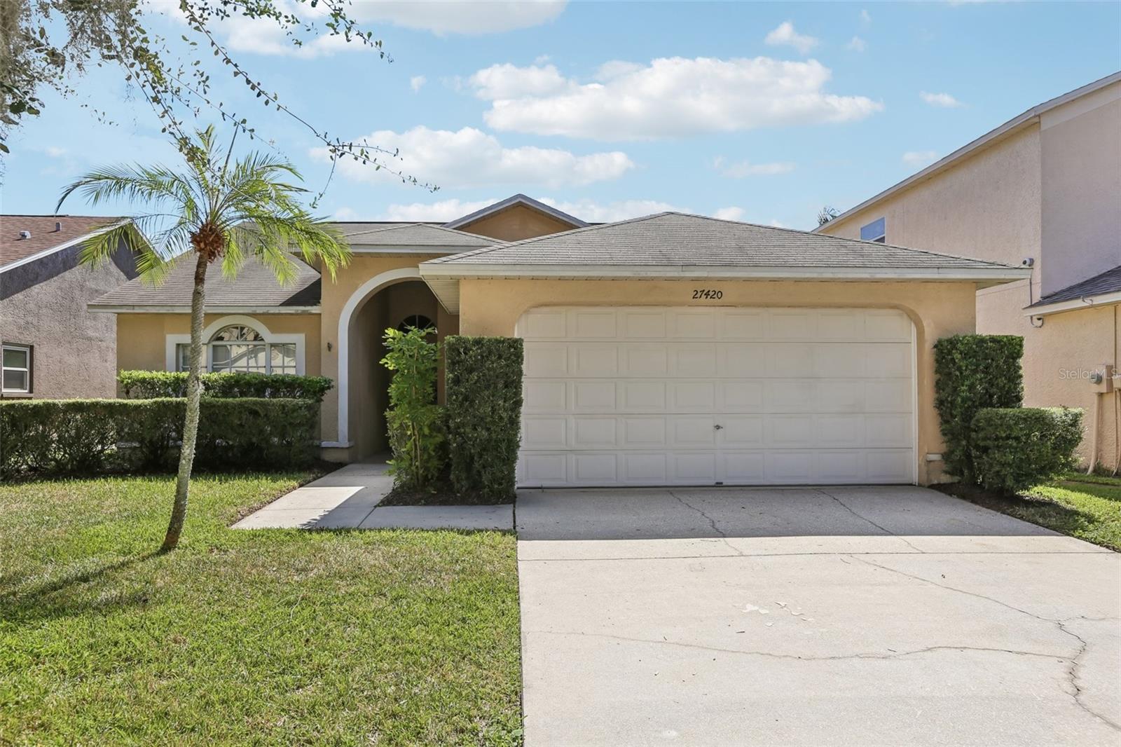 Just Listed! 27420 Breakers Dr is a 4-bedroom, 2-bathroom home offering 1,484 sq. ft. of living space and a 2-car garage in the established and desirable Northwood community. Built in 1995 and situated on a serene WATERFRONT lot, this home blends value, functionality, and future potential... ideal for today's selective buyers. With a 2014 roof, newer HVAC (March 2025), & newer kitchen appliances, this home checks the boxes for insurability and peace of mind. Inside, the layout features a spacious primary suite with en-suite bath, three additional bedrooms, and an open-concept living and dining area that flows into a central kitchen offering a great canvas to personalize over time. Enjoy Northwood’s amenities including a resort-style pool, clubhouse, tennis and basketball courts all with low HOA fees. Located just minutes from top-rated schools, The Shops at Wiregrass, I-75, and major employers, this home offers everyday convenience and long-term upside. Priced to reflect outstanding value in Wesley Chapel... schedule your showing today and check out the virtual 3D tour!