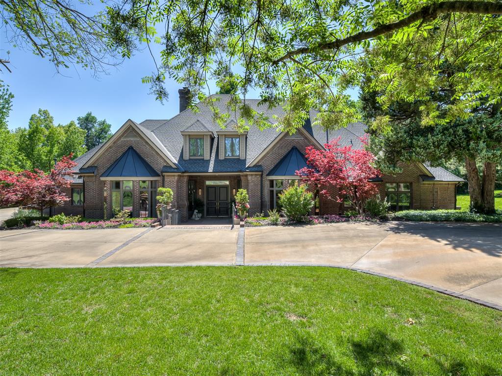 Located in the gated community of Oakdale Farm III, this 7,109 sq. ft. two-story brick home sits on approximately 1.07 acres and offers a blend of spacious living areas and private outdoor space. Built in 1992, the property features 4 bedrooms, 4 full bathrooms, and 1 half bathroom. The interior includes ceilings reaching approximately 22.5 feet and multiple living areas designed for flexibility and entertaining. The kitchen offers Cambria quartz surfaces and an open layout connecting to the main living spaces. Additional interior highlights include three living areas, a game room, hobby room, and a custom maple library or office. The home also features glossy porcelain tile flooring throughout the downstairs level and French arched windows that provide natural light. Additional amenities include three fireplaces, a cedar closet, a large laundry room, and a primary suite bathroom with a soaking tub. Outdoor living spaces include both covered and open patios as well as a screened porch overlooking a wooded setting. The property also includes a three-car garage equipped with an electric vehicle charging station, irrigation system, and landscape lighting. Oakdale Farm III community amenities include gated entry, a tennis court, pond, and creek.