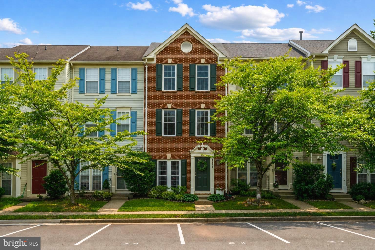 Are you looking for a move-in-ready home in a neighborhood with fantastic amenities? This is the one for you!  Check out this amazing three-story townhome in the commuter-friendly neighborhood of Ashburn Village - close to both the Ashburn Metro and the Washington Dulles International Airport. The whole home was recently painted and the flooring has been updated. Walk through the front door and see the stunning floors, open floor plan, a nice-sized living room. The living room opens to the gourmet kitchen, remodeled in 2018, with shiny granite countertops, stainless steel appliances, and a custom backsplash. The kitchen opens to a stone patio and a fully fenced backyard facing a beautiful wooded green space - the perfect place for morning coffee or evening meals. This level also includes a laundry room and stylish half bath. Heading upstairs, the second level includes a full bath remodeled in 2022, a nice sized bedroom, and a family room with a cozy gas fireplace, perfect for evenings with friends and family. On the third floor is the primary bedroom with a walk-in closet and a spacious bathroom remodeled in 2025. There is an additional bedroom on the third floor, bringing the total to three bedrooms in this home. The two dedicated parking spots located right outside the home, add to the overall convenience. Additional recent improvements include a new roof in 2016 and a water heater in 2022. Residents have access to the Ashburn Village Sports Pavilion, a 32,000+ square-foot recreation facility with fitness facilities, indoor and outdoor pools, tennis, pickleball, basketball, aquatics, and youth programming. Beyond the Pavilion, Ashburn Village has eight lakes and ponds, multiple outdoor pools, nine playgrounds, sports fields, basketball courts, tennis and pickleball courts, and an extensive network of trails and open space. The lakes allow catch-and-release fishing and the use of manually propelled boats, such as kayaks and canoes. This is one of those turn-key homes that you don't want to miss!