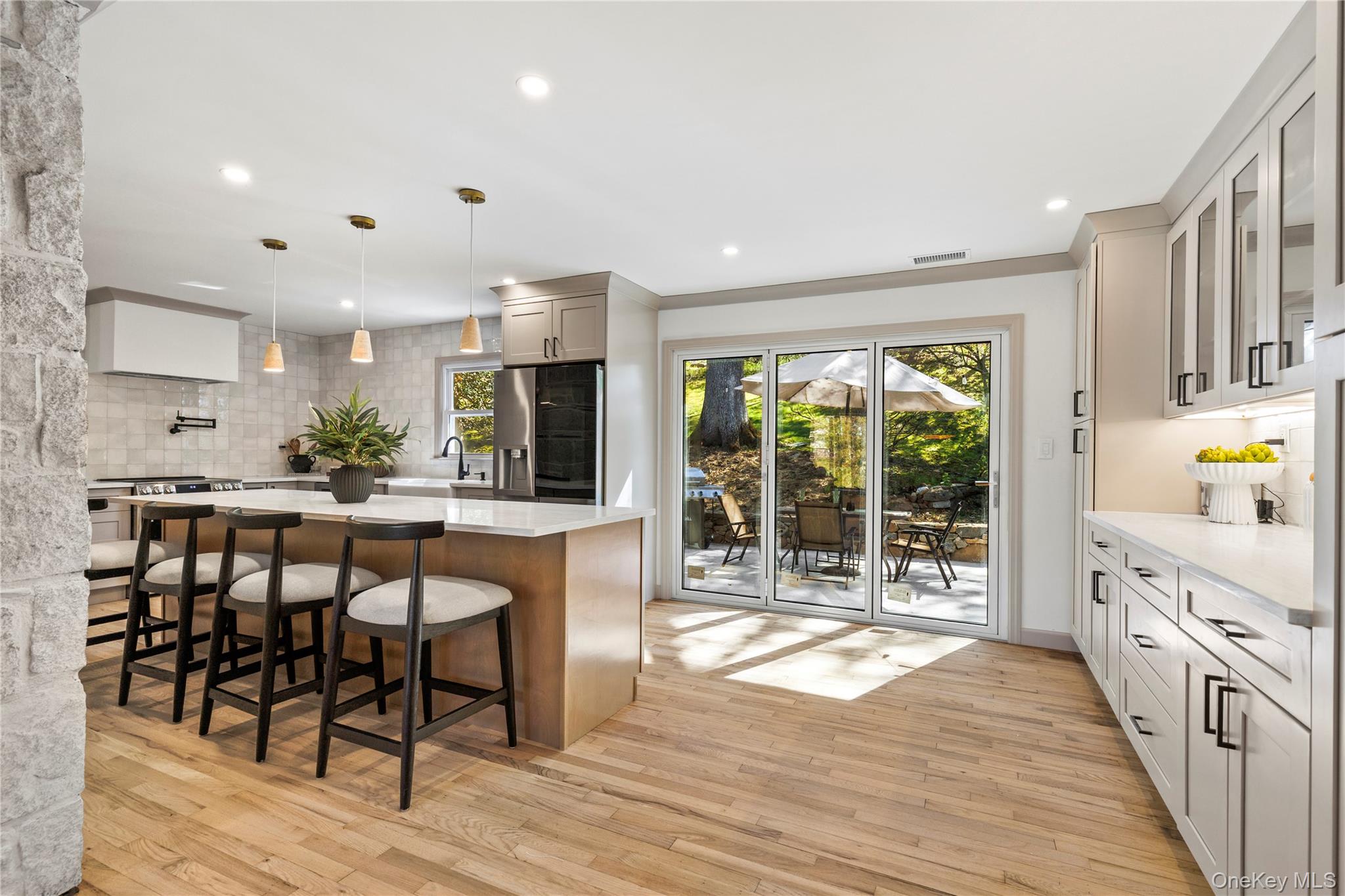 Just north of NYC, this move-in ready CHAPPAQUA home delivers effortless, elevated living—done RIGHT.3 min drive to Metro North station - 48 min ride to Grand Central Station *Set behind a long private driveway with an attached 2-car garage and expansive front yard, the property captures stunning sunset views, with golden hour pouring in the best way.Inside captures a calm, grounded palette with clean, high-end finishes that deliver a serene feel. The layout is open, airy and flows naturally, anchored by a striking limewashed fireplace.At the center a 10-FT ISLAND defines the kitchen with an extended space for additional storage and coffee bar.  Trifold door opens wide to create SEAMLESS INDOOR-OUTDOOR LIVING, leading to a multi-patio backyard designed for easy entertaining and memorable gatherings.The dining area is finished with a custom board and batten accent wall for added depth and character.Thoughtful details carry throughout—like the HIDDEN BOOKSHELF DOOR leading to a main-level laundry room, a SECOND laundry room in the basement and a custom entry bench with built-in Storage.The Bathrooms are designed with a spa-level feel, featuring heated floors, a soaking tub, and LED-lit mirrors.LED Recessed lighting runs all throughout the home * SMART HOME features include lights, appliances, heated bathroom floors, hot water system, thermostat and home surveillance system. < Motorized security camera system includedThe FINISHED BASEMENT offers flexible BONUS ROOM with an additional fireplace. Even the garage is upgraded with LED lighting and  garage flooring for a clean, functional setup.Located in a prime Chappaqua setting within a highly sought-after school district.Turn-key, well-designed, and ready to be lived in.Buyer agent to verify all info* note ; With so many options available Buyer has the opportunity to choose the shower glass they desire for Primary & basement bathrooms Brand new Hot water tank and Pressure TankAO