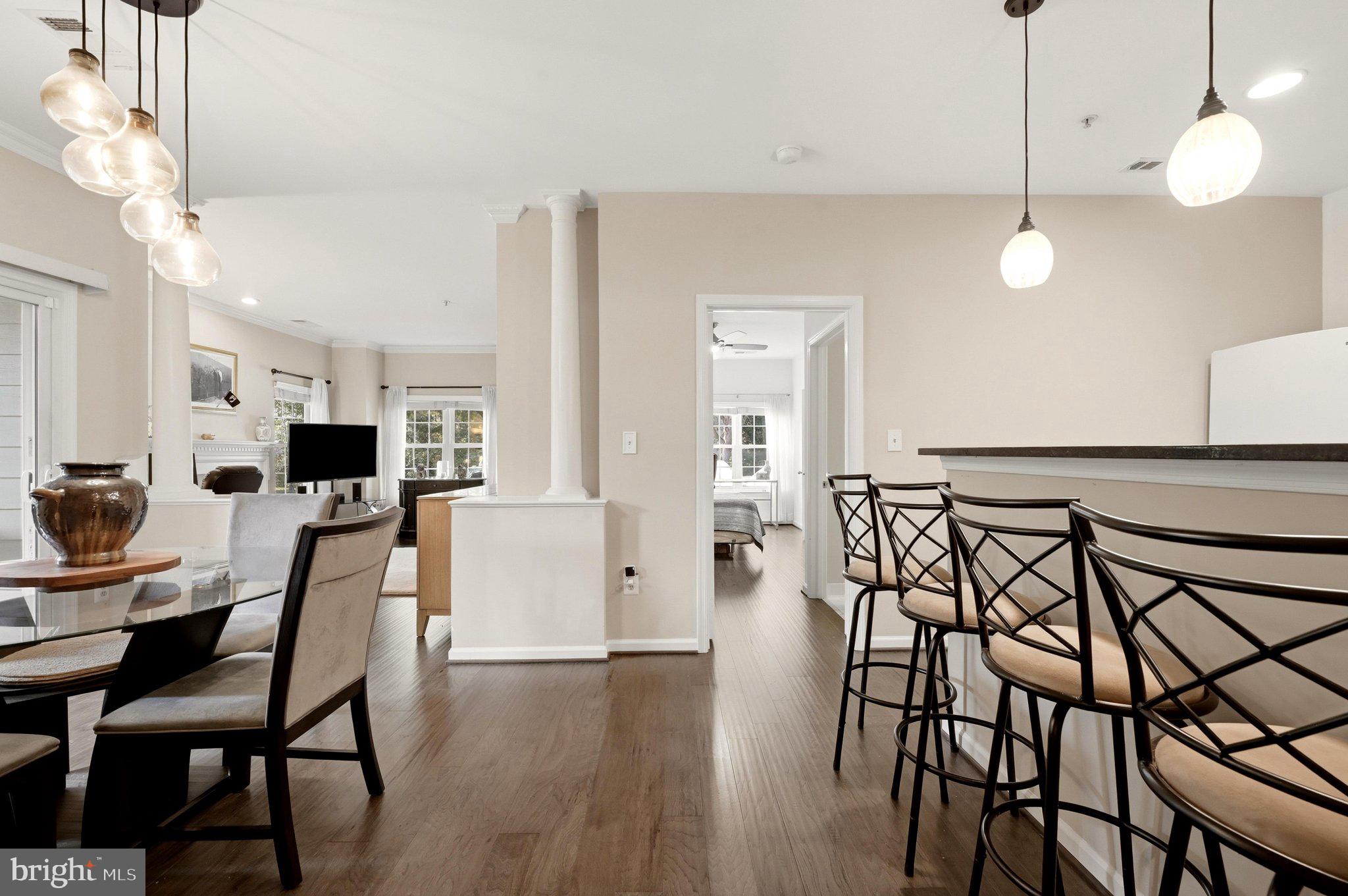 This is the one you've been waiting for! Rarely available ground-level 2 bedroom, 2 full bathroom corner condo with NO STAIRS and direct access to parking! Located in desirable North Reston, this updated home is within walking distance to Reston Town Center, Trader Joe’s, Reston Library, W&OD Trail, Capital Bikeshare, Reston Hospital, and the Reston Town Center Metro Station (1 mile away).Enjoy numerous updates including new engineered hardwood flooring (2025), new water heater (2021), and updated interior plumbing system/pipes ($6,000 investment). The stylish kitchen features soft-close cabinetry, leathered granite countertops, tile backsplash, an oversized sink, and under-cabinet lighting. The spacious living room offers a cozy gas fireplace, crown molding, and abundant natural light from the many windows.Relax on the covered wrap-around enclosed patio with beautiful sunset views — perfect for enjoying the outdoors. The primary suite includes a large custom-built walk-in closet, and there’s an extra storage closet just steps from your front door, providing valuable space for seasonal items, bikes, or additional belongings!This pet-friendly community offers fantastic amenities including a lifeguarded outdoor pool, community center, fitness center, scenic pond, walking trails, dog areas, and plenty of mature trees and green space. Parking is easy with one owner pass, two guest passes, and plenty of guest parking directly across from the building.Tucked away in a peaceful, nature-filled setting while still close to major commuter routes and Dulles Airport, this North Reston condo offers the perfect combination of convenience, comfort, and value. Don’t miss it! *Full list of updates in documents section*