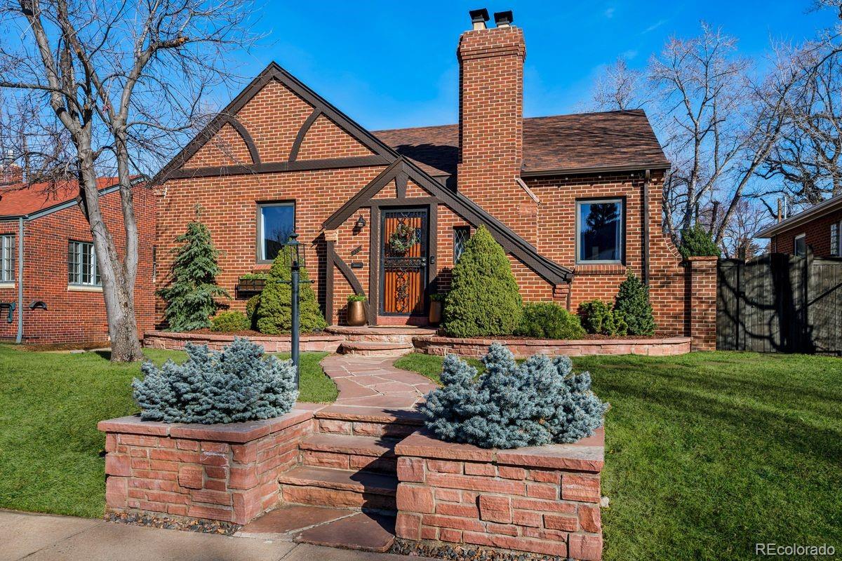 Quintessential Bonnie Brae brick tudor on a curvy street just half a block to the park. This home exudes charm at every corner. Meticulous care has gone into preserving the character while adding modern amenities. There is real pride of ownership here. The bright and sunny kitchen offers plenty of cabinets and counter space, along with newer high-end appliances, including a Bosch dishwasher and an electric range with gas hook-up capability. The main level is drenched in natural light and features a perfect entry nook, open great room with cozy gas lit wood burning fireplace, a spacious kitchen, a beautiful primary suite with custom built-in closets, an additional bedroom, a full bath, and an oversized mudroom that offers flex space that could be ideal for a home office. Downstairs is a warm and inviting family room with gas fireplace, a comfortable guest bedroom and full bath, second basement bedroom with outdoor entry access, extensive storage and roomy laundry room. There are multiple storage closets, including a space ideal for a wine cellar. Central air conditioning has been newly added for summer comfort. The backyard has been professionally landscaped with Colorado Red Flagstone, mature trees, tranquil water fountain, two car garage with additional storage, and offers various seating and lounge areas for summer cookouts and BBQ's. This is one of the best locations in Bonnie Brae; just half a block to the park, minutes to Campus Lounge, Bonnie Brae Ice Cream, the shops and dining on South Gaylord, and easy access to Cherry Creek. Can't beat this perfect home!