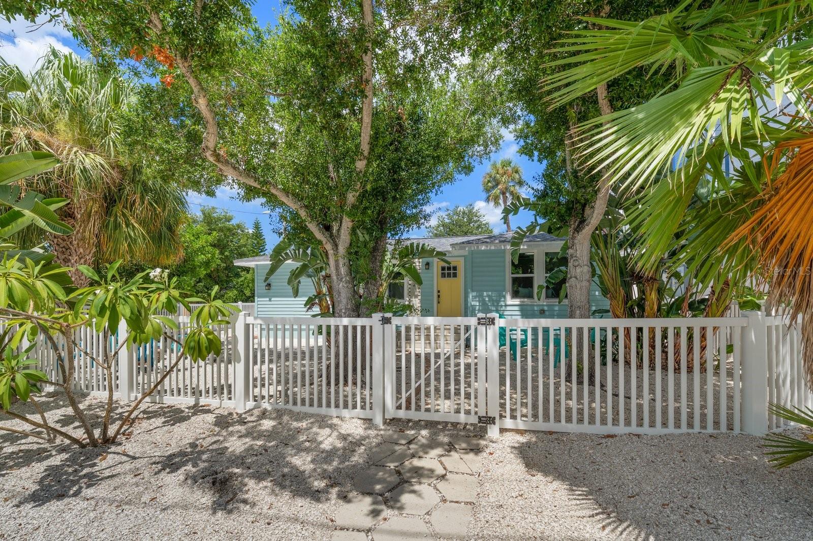 Introducing “The Coconut Cottage,” an exceptional Downtown Dunedin Bungalow where timeless coastal charm meets modern luxury in one of the area’s most sought-after locations. Perfectly positioned within the coveted Downtown Core (DC), this rare offering is just two blocks from Main Street, moments from the Gulf of Mexico and located in a non-flood zone with NO HOA. Even more remarkable, the property is zoned for both residential and commercial use, allowing Short-Term Rentals (daily, weekly, monthly, or annual), creating a truly unique lifestyle and investment opportunity. Thoughtfully renovated with an effortless blend of finishes and authentic bungalow character, this 3-bedroom, 2-bath residence welcomes you with soaring vaulted ceilings, abundant natural light and an open-concept design that lives far larger than expected. Every detail has been carefully curated, from the wide-plank bamboo luxury waterproof flooring and coastal farmhouse trim to the matte black hardware, designer lighting, LED recessed lighting, hurricane-impact windows, and French doors that seamlessly connect indoor and outdoor living. At the heart of the home, the beautifully appointed kitchen combines style and functionality with soft-close white shaker cabinetry, butcher block countertops, a classic white beveled subway tile backsplash, Frigidaire Gallery Series appliances, a movable center island, and a dedicated interior laundry area complete with premium LG washer and dryer. Designed with privacy in mind, the desirable two-way split floor plan features a tranquil primary suite tucked away from the guest bedrooms. The en suite bath evokes a boutique coastal retreat with its striking blue subway-tiled walk-in shower, penny tile flooring, updated vanity, and refined finishes. Two additional bedrooms are thoughtfully positioned on the opposite side of the home and share a spacious, beautifully updated guest bath.Significant improvements provide exceptional peace of mind, including a 2023 Roof, 2019 A/C, updated electrical and plumbing, hurricane-impact windows and a craftsman-style front entry door. Outside, the inviting yard offers a private coastal setting complete with crushed shell walkways, a fenced yard, a charming fire pit gathering area, additional storage and ample rear parking on the spacious corner lot.The lifestyle is simply unmatched. Walk to Main Street’s award-winning restaurants, boutique shopping, breweries, the Pinellas Bike Trail, Dunedin Marina and spectacular waterfront sunsets at Edgewater Park. Leave the car behind or hop in your golf cart and experience one of Florida’s most beloved coastal communities exactly as it was meant to be enjoyed. Whether you’re seeking a distinctive primary residence, an elegant seasonal escape, an income-producing Short-Term Rental, The Coconut Cottage delivers a rare combination of location, versatility and enduring appeal. Extraordinary opportunities like this seldom become available in the heart of Downtown Dunedin. This is more than a home—it’s an invitation to embrace the quintessential Florida coastal lifestyle while owning one of Dunedin’s most unique and desirable properties.