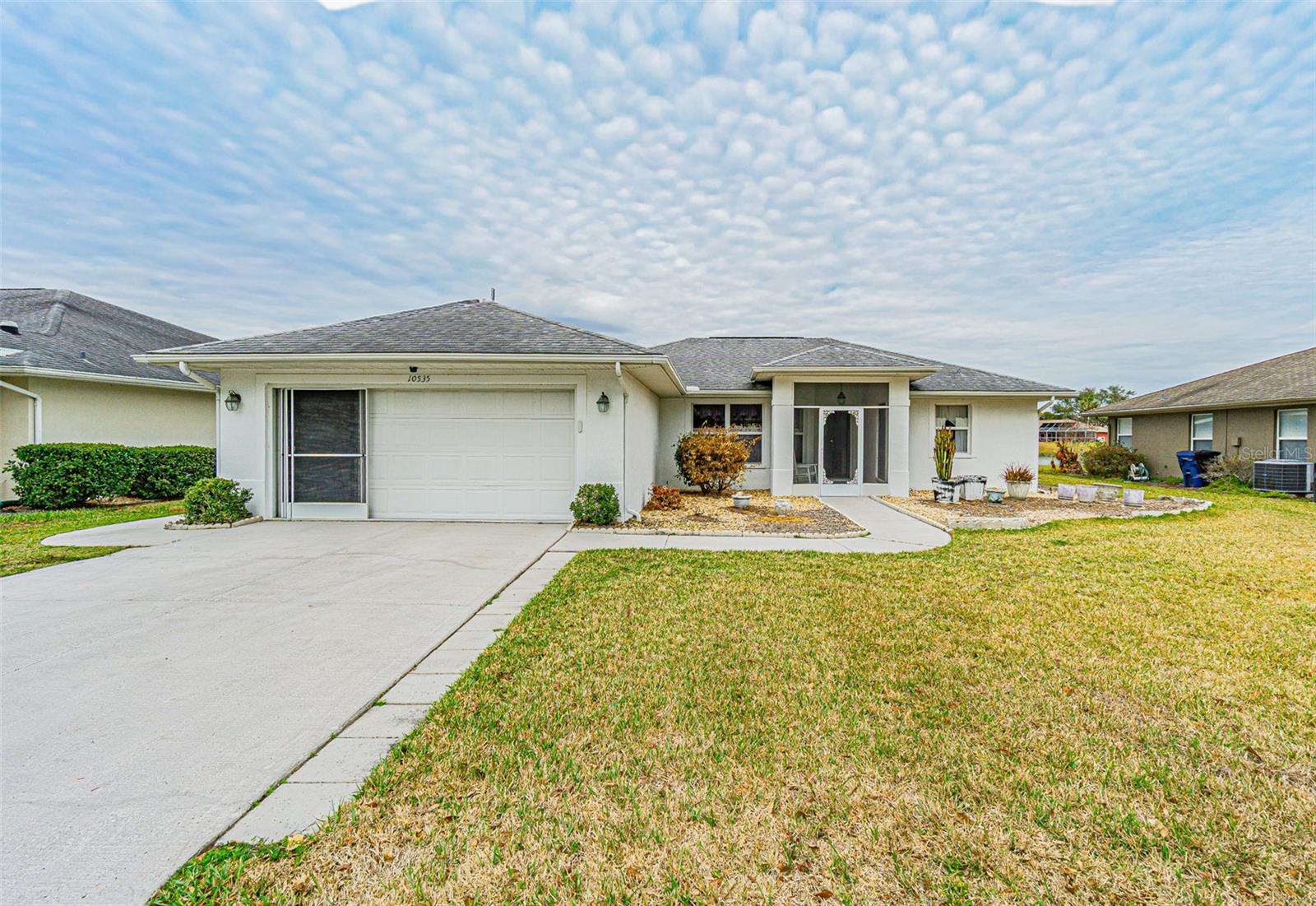 Enjoy starting your day with some of the most amazing views in all of the Tampa Bay Golf & Country Club community, and then ending the day watching some of the most amazing sunsets on the planet, all over your picturesque pond featuring many species of wildlife. Withing days you'll realize why this subdivision is named Deer Hollow, you'll see several deer every day. This home is awaiting your updates to make it the home of your dreams all while living in the incredible TBG&CC neighborhood! This 1,251 square foot home features two bedrooms, two baths, a wide open floor plan with tile flooring throughout the great room and kitchen, and carpet in the bedrooms. The home features solid granite throughout. The lanai is AMAZING and measures more than 32'X15'! TBG&CC has two incredible golf courses, the 18-hole Championship course and a 9-hole executive course. The golf courses here are impeccable and very well-maintained. Tampa Bay Golf & Country Club is Tampa Bay's premier active 55+ community featuring two swimming pools (the large resort-style pool has fountains and is heated to a balmy 80 degrees). Pickleball, tennis, cards, bocce, shuffleboard, cornhole, and more activities than anyone could possibly do! Our new activities center has a HUGE fitness center with state-of-the-art fitness equipment, a beautiful billiards room, and an amazing card room. TBG&CC has no CDD and very affordable HOA charges, which include Cable/Internet/DVR and Mini Box. The Tampa Bay Golf & Country Club is Tampa Bay's most desirable 55+ Active community. All room sizes are approximate and should be confirmed by the buyer. Furnishings are available outside of contract.