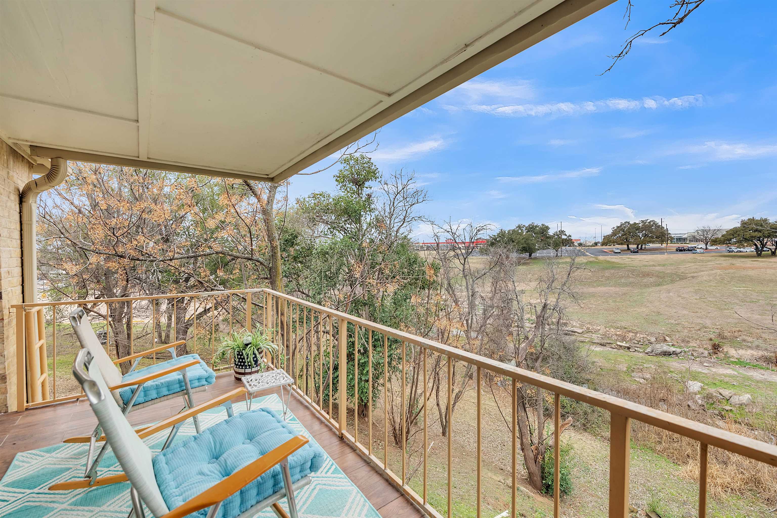 **OWNER FINANCING AVAILABLE***FULLY FURNISHED CONDO in the HEART of MARBLE FALLS, TEXAS!  This hidden treasure has 1507sf with 3 beds and 2 full bathrooms AND large COVERED BALCONY with access from the LIVING AND the PRIMARY bedroom.  Living Room 8’ glass sliding door WITH ELECTRIC SHADES provide views of a wooded draw. Front bedroom has an en-suite bathroom that also has HALLWAY ACCESS for guests.  Secondary bedrooms have a well-designed jack and jill bathroom with a walk-in shower and separate sinks. Updates include plantation shutters, LVP wood-look flooring throughout; recent paint and recent appliances. Samsung STOVE WITH BUILT IN AIR FRYER; GE refrigerator and dishwasher; GE WASHER/DRYER COMBO UNIT in utility closet; all convey. ONE CAR GARAGE WITH OPENER included with Unit. Unit was occupied seasonally as winter retreat. SMALL CONDO REGIME; Dues $250/month.  One block from HEB and ONE BLOCK from Hwy 281. Make this your new VACATION, STAYCATION RETREAT!