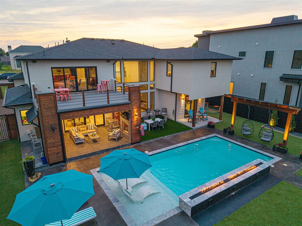 Designed for the discerning homeowner, this contemporary masterpiece in prestigious Nichols Hills offers approximately 4,800 square feet (MOL) of exceptional living space, not including the beautifully finished pool house, man cave, and garage apartment. The main living area features soaring 22-foot ceilings, a sleek linear fireplace, and expansive walls of glass that create a seamless connection between indoor and outdoor living.The chef’s kitchen is equipped with commercial-grade appliances, an ice maker, and a dedicated wine refrigerator. The upstairs primary suite provides a true retreat with dual walk-in closets, while the bonus/game room with a built-in bar opens to a spacious balcony overlooking the manicured grounds.Outdoor living is exceptional, offering a saltwater pool with elegant water features, a pergola, outdoor fireplace, fire pit, turf grass, two covered porches, and extensive exterior lighting. Additional upgrades include a whole-home generator, tankless water heaters, security cameras, indoor and outdoor speakers, electric shades, and a built-in water bottle filler.A standout feature of the home is the state-of-the-art Lennox PureAir System, providing hospital-grade air quality by eliminating airborne particles, allergens, and neutralizing contaminants.Every detail has been curated to enhance comfort, security, and entertainment. This residence is more than a home—it is a modern lifestyle experience in one of Oklahoma’s most sought-after locations.