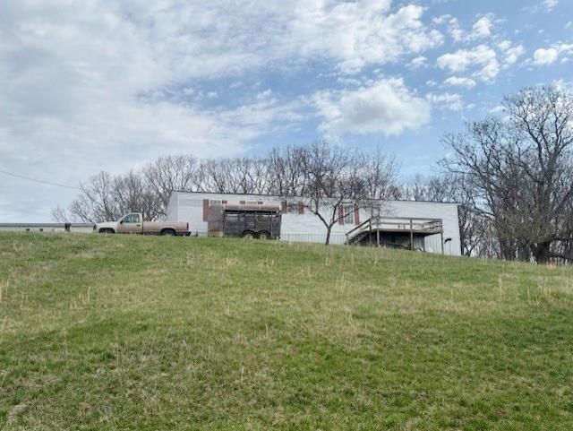 3 Bedroom, 2 bath singlewide located on 0.88 acres view front porch farm views.