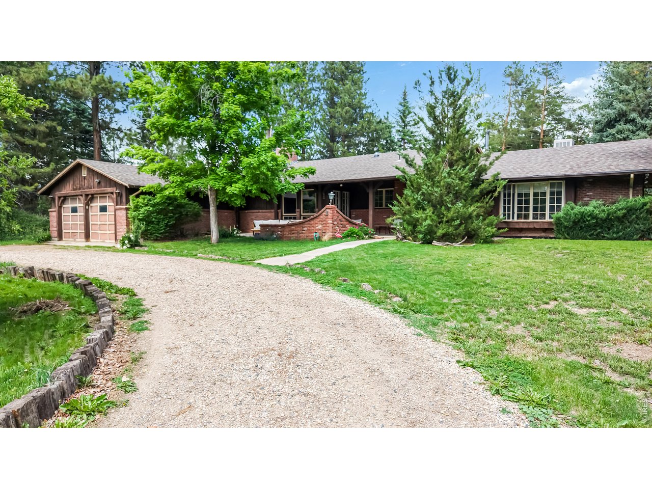 This gem has a distinctive blend of privacy, accessibility, charm and views! Positioned along the northern edge of Fort Collins where open landscapes meet in-town convenience. Enjoy a peaceful mountain feel while traveling up the long curving drive or sitting on the patio as the home is situated on a slight rise tucked into a wooded glen with views of the 10 acres as it slopes away from the home. The home is a Mid Century Modern beauty waiting for your designer touch as comfortable open gathering spaces prioritize functionality, natural light, brick elements and an easy flow between everyday living areas. The primary living room anchors the residence with stylish vintage wood beams, brick facade and cozy fireplace. Second living area entices with an artistically inspiring pot belly stove for a surprising 1800's charm. Large windows draw daylight throughout the interior, reinforcing the connection between the home and its surrounding landscape. The kitchen is a practical hub within the floor plan while French doors connect to outdoor living space. The bedroom spaces allow separation between gathering areas and quieter retreats. The property offers room for entertaining, gardening, recreation, hobby farm, horse ranch, or simply enjoying the views of Colorado's changing seasons. Additional shop with separate drive and electricity is tucked away along the road and currently rented at $600/month. Within convenient reach of Old Town Fort Collins, the Poudre River Trail, and numerous natural areas that support hiking, cycling, fishing, and year-round outdoor recreation this home defines northern Colorado and presents an amazing opportunity. New furnace and A/C installed in 2025. Water rights excluded. 1/10 share of Jackson ditch (with information available supporting continuous historical beneficial use) may be for sale separately.