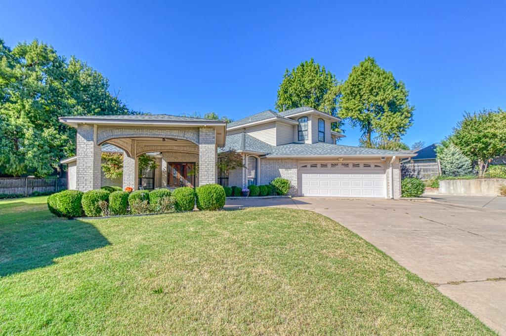 Welcome to 3617 Hampton Court  nestled in a quiet Cul-de-sac close to all your favorite shops and restaurants. This spacious home features 3,505 of living space with 3 living areas, study, 4 bedrooms and 2 and a half bathrooms. Step inside to the first living area with a gas fireplace that is shared and separates the second living area. Off the first living area is the formal dining room and the study. Step into the second living area and enjoy that same fireplace with bookshelves on each side. The spacious kitchen is open to this second living area with lots of room to cook and plenty of cabinets for storage. The island serves as work space or seating for meals.  The Florida room is also off the second living area and this room would be great for so many things with its  vaulted ceilings and 3 sliding doors with so much sunlight coming through. The primary suite which is located downstairs is a true sanctuary, offering a luxurious en-suite bathroom with double vanities and generous closet space with laundry room inside the closet. The Additional bedrooms which are located upstairs are spacious with walk in closets. The bathroom upstairs is truly amazing with double vanities including a sitting area to get ready. The tub is a large soaking with shower. You will also find a second laundry room upstairs so no hauling laundry downstairs.  The front of the home has a covered parking area or use it for a large covered patio. Out back you will find a deck the whole length of the back of the home.  This home is in impeccable condition, showcasing an abundance of natural light through numerous windows. Recent updates include a roof that is two years old, two separate HVAC systems that were installed in 2024.