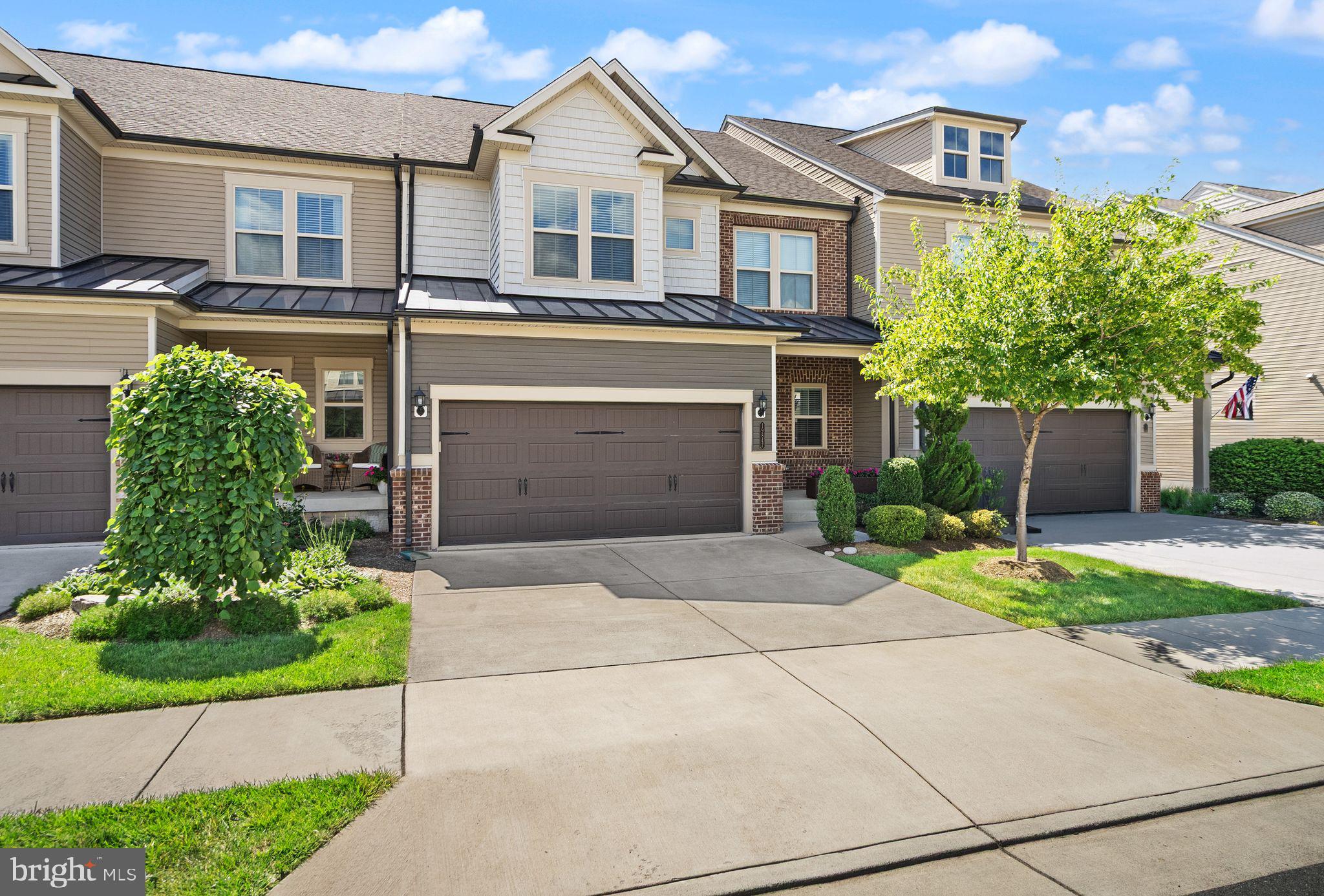 Welcome to 19847 Silvery Blue Terrace, a beautiful townhouse in Ashburn’s sought-after Active Adult 55+ community of Lexington 7. This property is located on a premium lot with picturesque views of the protected woods, open common area, and the pond, eastward facing with breathtaking sunsets from the back porch. Built in 2019, the Aston model boasts 3400 finished square feet on 3 levels with 2 car garage as well as two driveway parking spaces. Entering from the covered front porch, you are greeted with an open layout where entertaining is easy and hardwood floors run the expanse of the main level. Here you will find a gorgeous kitchen with white cabinetry, granite countertops, a spacious island, stainless steel appliances, to include a gas cooktop and range hood. Bright and light with soaring ceilings, the dining room and family room lead to a large composite deck with a retractable awning and stairs to the lower level. The main level primary suite includes an ensuite bath with an oversized frameless glass doored shower, double vanity, and an enormous walk-in closet. The powder room, laundry room, and an office complete the main level. Upstairs are two generously sized bedrooms that share a beautiful hall bath, plus a second family room, and large storage room. The lower level recreation room is 800 square feet of finished living space with a walk-out to the patio. There is also a big unfinished space designed to be a 4th bedroom along with a bathroom rough-in. Freshly painted, Silvery Blue is ready for its new owner to enjoy! This community has a popular pickleball court and is walking distance to restaurants and shops across the street as well as the trails along the Potomac River. One Loudoun is minutes away along with two silver line metro stops, Dulles Airport, and INOVA hospital center. Photos to post Friday June 26th.