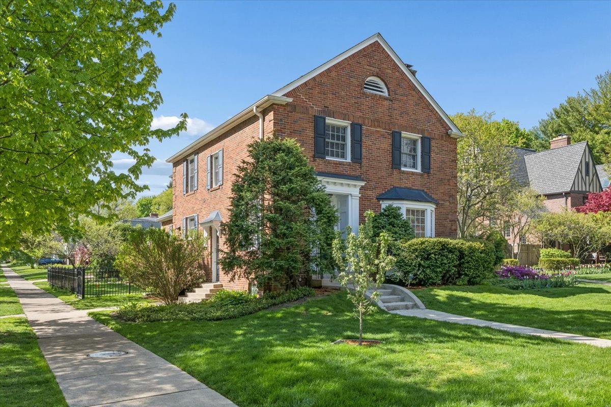 Beautifully updated brick Georgian on a charming corner located within the highly sought-after Joseph Sears and New Trier School Districts. Originally built in 1926 and thoughtfully renovated and expanded, this home blends timeless architecture with modern living. Sun-filled interiors feature hardwood floors throughout, a gracious living room with fireplace, formal dining room, and an expansive family room ideal for everyday living and entertaining. The kitchen offers granite countertops, maple cabinetry, stainless steel appliances, and a breakfast bar. Upstairs includes a serene primary suite with spa-like bath, plus two additional bedrooms and a full bath. The finished lower level provides a second family/media room and full bath for added living space. Enjoy a private fenced yard and brick paver patio, perfect for outdoor entertaining. Ideally located near Sears School, New Trier, Metra, parks, and the lake-offering an exceptional North Shore lifestyle.
