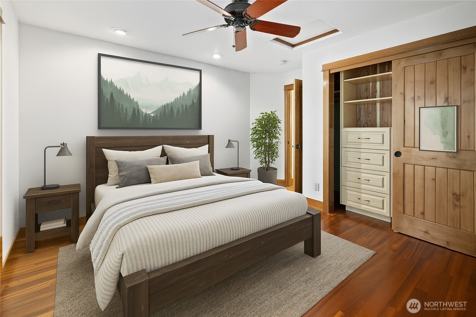 The 2nd upstairs bedroom features custom built-in closets, offering both functionality and style. Along with your own private deck to enjoy your morning coffee in the fresh mountain air.