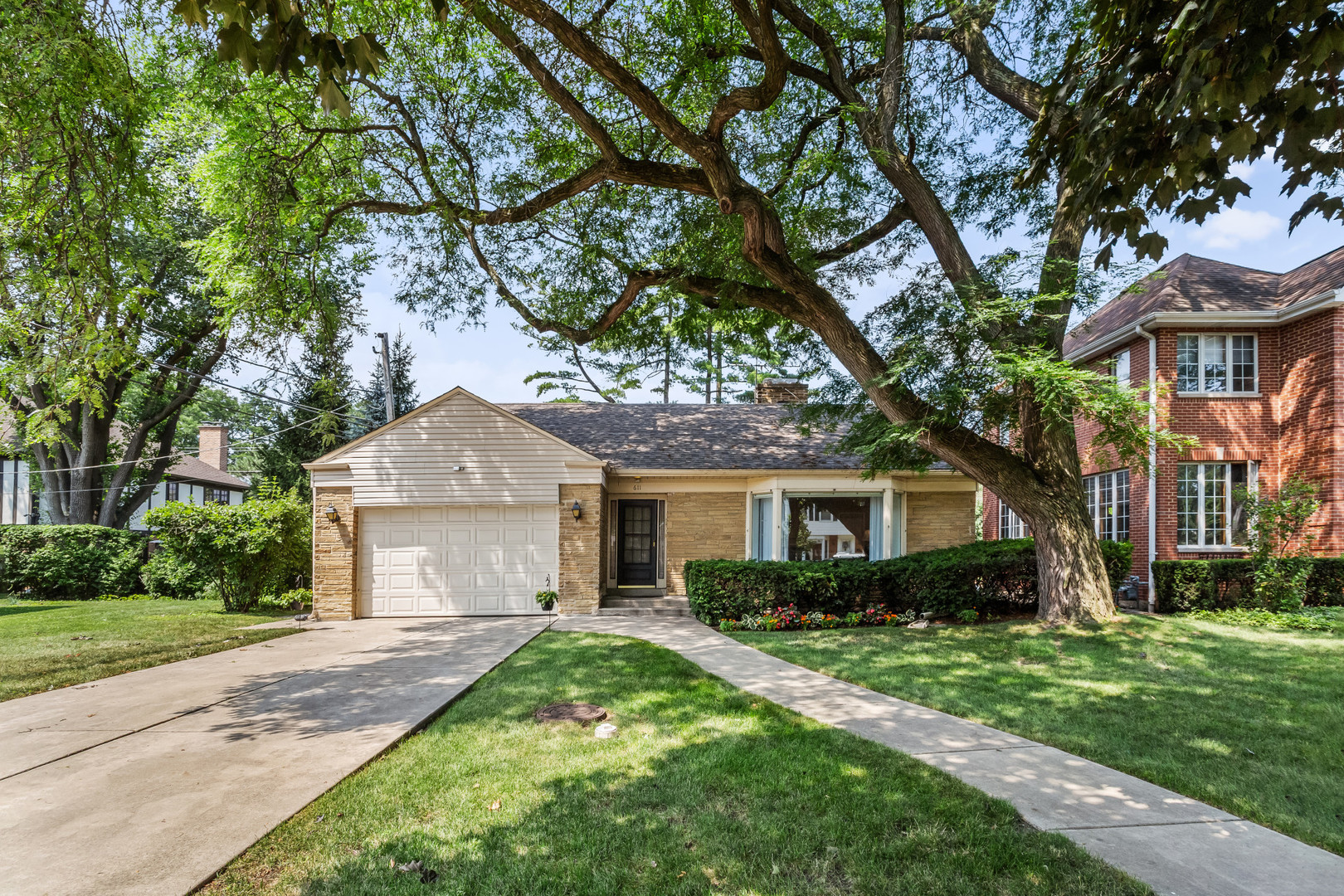 Welcome to 611 East Avenue - a rare opportunity in one of Park Ridge's most sought-after neighborhoods. Set on an oversized 60-foot lot, this well-maintained and bright, sun-filled home blends timeless charm with endless potential. The main level features a spacious living room, a dedicated dining area, and an airy office that easily functions as a third bedroom. The huge primary suite offers comfort and abundant closet space, while the second bedroom is generously sized. The kitchen, while original, is thoughtfully laid out with excellent storage and quality appliances, including a KitchenAid double oven and French door refrigerator, Frigidaire cooktop and dishwasher, and a Thermador range hood-ready for your updates or continued use. The high-ceiling basement offers incredible flexibility with a full bathroom already in place-ideal for creating a future in-law suite, teen hangout, or expansive rec space. Outside, enjoy a spacious, landscaped backyard with a patio perfect for relaxing, playing, or entertaining. Flood control system, new roof, and a garage complete the package. With a jetted tub and separate shower in the main bath, a flexible layout, and a location that's second to none. This is your opportunity to plant roots and grow in Park Ridge.