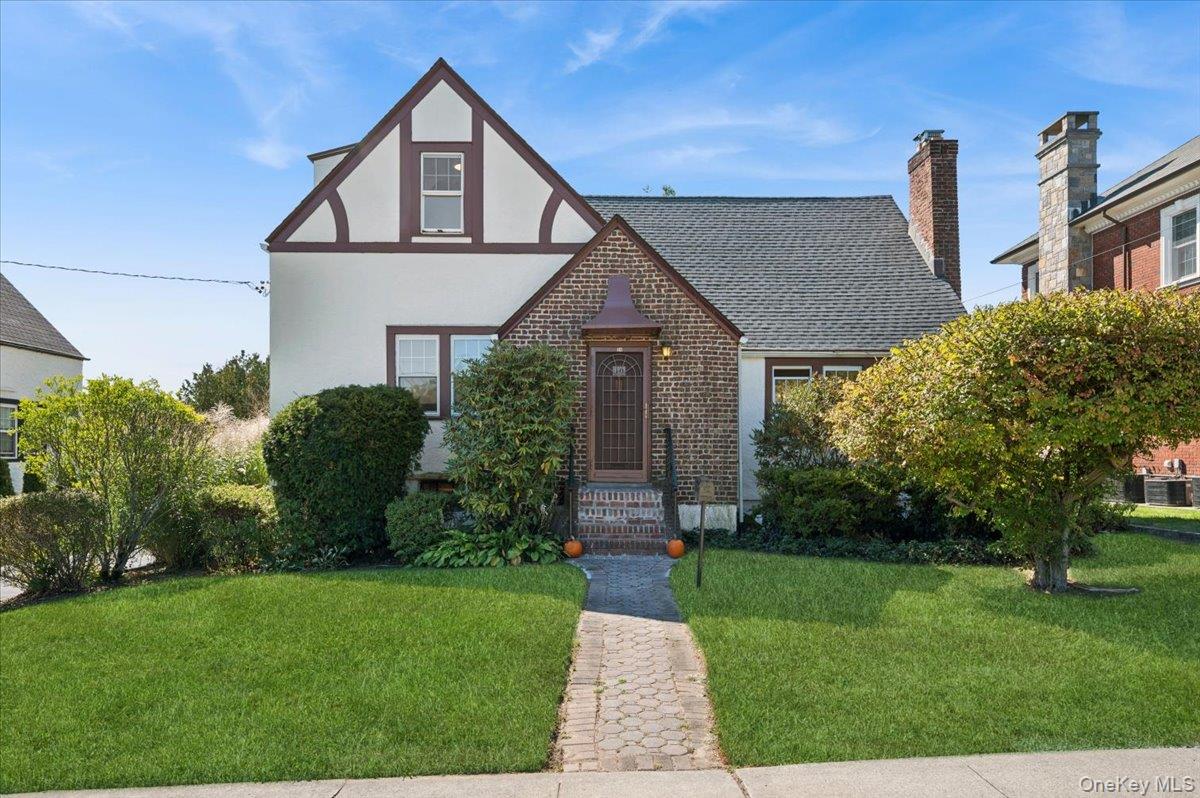Welcome to 10 Oakland Avenue. This charming, light-filled, move-in-ready 4-bedroom, 2-bath Tudor-style home is located on one of the premier blocks in Colonial Heights. As you enter, you will be captivated by the light from three different exposures. This home is ideal for living and entertaining with an easy flow. The first floor features an open living room with a wood-burning fireplace (WBF), a spacious dining room, and an updated kitchen with new porcelain-tiled floors, stainless steel appliances, and hardwood cabinets. There are also two generously sized bedrooms: one currently used as the primary and the other perfect for a den. Through the kitchen is a 3-season enclosed porch leading to a wood deck and private backyard. Upstairs, a large landing leads to two additional bedrooms and a second full bath.

The basement contains a finished room with a new floor, ideal for a gym or play area, a laundry room, and a utility room. The house has been freshly painted, with red oak hardwood floors throughout. The roof was replaced in 2020. There is a shared driveway, off the street, with a private one-car garage. The driveway was repaved in 2020 with a new drainage system installed. A new sump pump and garage floor were installed in 2025.

The location is extremely convenient. minutes to Metro North, Bronx River Parkway, Central Avenue, and the villages of Tuckahoe and Bronxville.