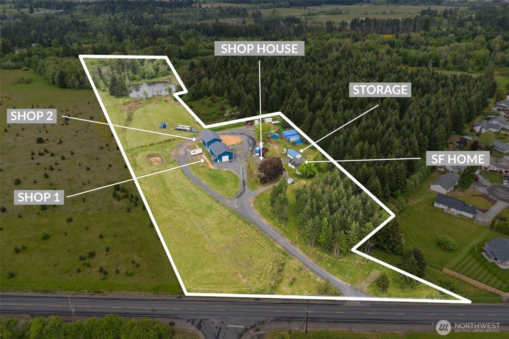 12.53± ac commercial/industrial property located just 3 mi from I-5. Currently operating under a special use permit for manufacturing, the property features two custom-built 60' x 40' shops, both certified for organic production—ideal for food, supplements, or clean manufacturing. There are 2 wells on site with water rights (5000 g/day) along with 3-phase power, 408 volts. The primary shop features an office and bathroom providing an on-site workspace; there is also a shophouse, an additional storage building, and a single-family home offering flexibility as a residence, office, or employee housing. With plenty of yard space for storage, parking, or future expansion, this site is well-suited for a growing business needing room to scale.
