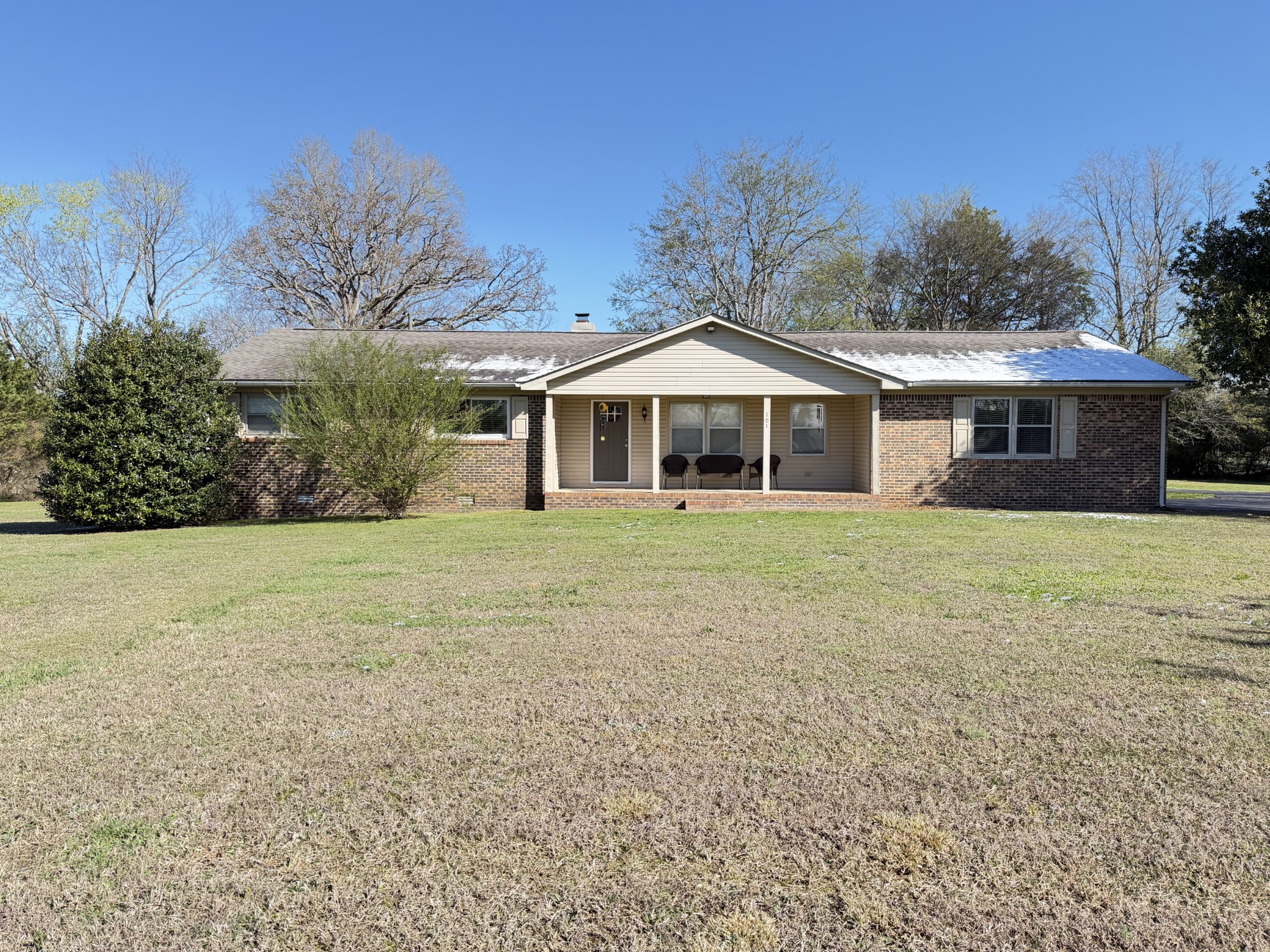 Welcome to this well-maintained 3 bedroom, 2 bath brick home situated on 1.3 acre lot in a quiet well-established neighborhood just minutes from the lake. This charming property offers the perfect balance of privacy space and convenience, making it ideal for families, downsizing, or anyone looking to enjoy peaceful living close to outdoor recreation. The home features a bright and inviting living room, a well-appointed kitchen with plenty of counter and cabinet space, and a dining area perfect for everyday meals and entertaining. The primary bedroom includes a private full bath, while two additional bedrooms provide flexibility for guests, family members, or a home office. Step outside to enjoy the screened in back porch, providing the perfect space to relax, entertain, or enjoy the outdoors while staying protected from the elements. The expansive 1.3-acre lot offers plenty of room for outdoor activities, gardening, or simply enjoying the peaceful surroundings. The classic brick exterior adds timeless curb appeal and durability or low-maintenance living.