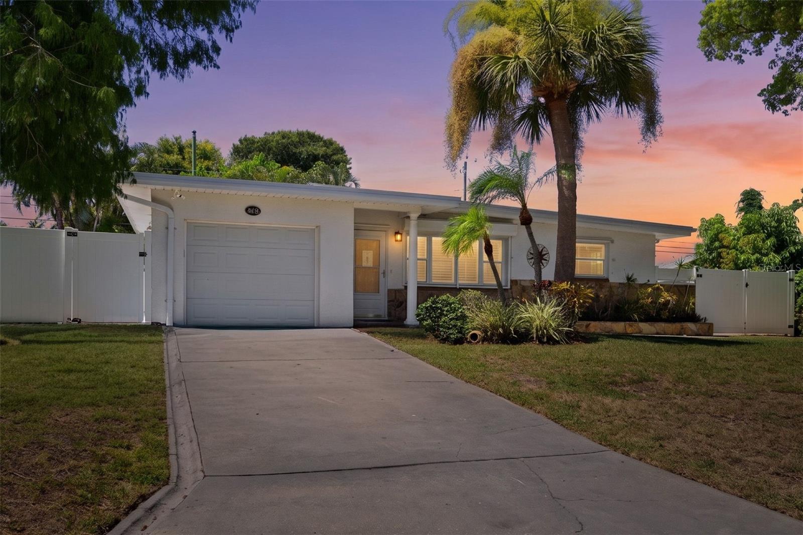 Virtually Staged. Welcome to one of the best opportunities to own a pool home on Florida’s Gulf Coast. Located in Largo, less than half a mile from the Gulf of Mexico, this move-in ready 3-bedroom, 2-bath, 1-car garage block home offers the rare combination of coastal living with the peace of mind of a non-flood zone, non-evacuation zone, and no HOA. Whether you’re searching for a primary residence, second home, vacation getaway, or investment opportunity, this property delivers the Florida lifestyle buyers dream about while offering exceptional long-term value in an established area of Pinellas County.Picture yourself starting the day with coffee beside your heated and cooled saltwater pool, spending afternoons entertaining family and friends, and ending the evening surrounded by tropical landscaping beneath colorful Florida sunsets. The fully fenced backyard is a private retreat framed by mature Areca palms, blooming hibiscus, fragrant gardenias, and lush landscaping that create a peaceful escape just minutes from the beach. An expansive travertine pool deck offers generous space for outdoor dining, relaxing, and making the most of Florida’s year-round outdoor lifestyle. The south-facing backyard enjoys sunshine throughout the day while filling the home with beautiful natural light from sunrise to sunset.Inside, an abundance of natural light highlights the home’s inviting mid-century character. Luxury vinyl plank flooring, plantation shutters, fresh interior paint, freshly cleaned tile, an indoor laundry room, and double-pane windows create a comfortable, move-in ready living environment. A wall of double-pane windows across the spacious Florida flex room seamlessly blends indoor and outdoor living, capturing peaceful views of the backyard and making the pool feel like a natural extension of the home.Recent improvements include a 2026 roof, updated electrical panel, hurricane shutters, a 2024 water softener, a 2016 water heater, and a 2014 HVAC system professionally maintained under a service contract since 2020, providing added confidence for the next owner.Living here means more than owning a home. You’re just moments from the Gulf beaches, scenic parks and nature trails, neighborhood boating access, top-rated healthcare and hospitals, convenient grocery stores, shopping, everyday essentials, endless dining options featuring fresh seafood and local favorites, live entertainment, and easy access to Tampa International Airport. Whether your day includes the beach, boating, dining, shopping, or simply relaxing poolside at home, this location checks every box for convenience, recreation, travel, and the Florida lifestyle.Home is being sold unfurnished. Some listing photos have been virtually staged.