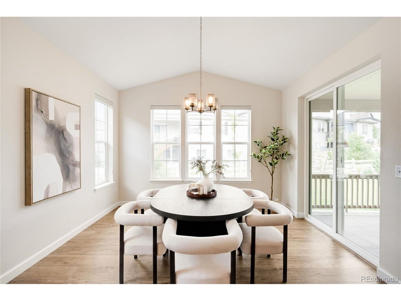 Steeped in an enviable locale on a quiet, spacious lot surrounded by parks in coveted Southshore, this refined residence is characterized by open, bright interiors and modern finishes. A stately stone exterior welcomes residents further inside to a thoughtful floorplan w/ plentiful windows, high ceilings & chic design. The open layout flows easily from the expansive foyer to the formal dining room to the open entertainment space in the kitchen + living room with a gas fireplace. This chef's kitchen presents a large center island, shaker cabinets, walk-in pantry, butler's pantry and storage galore. Enjoy indoor/outdoor connectivity w/ large patio doors flowing to the covered deck for al fresco dining. The main floor also boasts a private bedroom/office. Retreat upstairs to the expansive primary that impresses w/ exceptional natural light, dual vanity, designer shower & a spacious walk-in closet. Enjoy the convenience of three additional large bedrooms, 2 full baths and even a bonus loft/flex space with walls of windows. The lower level plays host to additional living space under tall ceilings where you can find an additional bedroom, a gym/flex space, living room, another full bathroom and plentiful storage. Outside, the backyard is an entertainer's or gardener's dream, featuring a sizable patio, mature landscaping, trees and a fenced yard space. Residents enjoy the convenience of an attached 3-car garage and a true laundry room with sink and cabinets. Southshore is well known for being a slice of green heaven, with both outdoor enthusiasts and urban explorers making their home in neighborhood with two amazing clubhouses, pools galore, trails, lake access, pond, parks, playgrounds and ongoing community events!