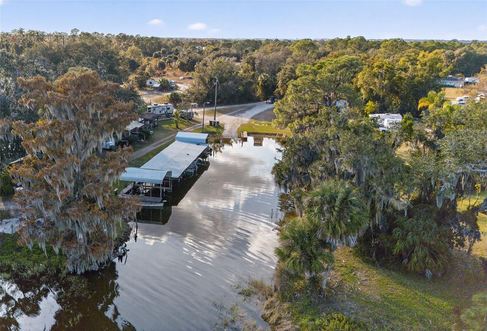 Rare Lake & Lagoon Frontage Vacation Destination Business Opportunity on Tranquil Lake Marion.Bannon Fish Camp is a legendary angler’s retreat, proudly serving fishing tournaments and vacationers since the 1950s. This beloved, old-Florida property has remained in the same family for four generations and offers a truly unique blend of history, income, and waterfront access.An expansive dock at the mouth of the lagoon provides convenient boat launching, while the lagoon itself features approximately 233 feet of navigable frontage leading directly to the Lake Marion outlet. The fish camp includes seven boat slips along the lagoon, currently rented at $150 a month each. An additional concrete dock at the lagoon outlet accommodates larger vessels and cargo transport.All fish cabins are fully occupied with long-term tenants, and additional on-site trailers and dwellings are also tenant-occupied, generating approximately $3,800 in monthly rental income.This offering presents an exceptional opportunity for investors, operators, or those seeking a historic waterfront business. The property may also be purchased in combination with the adjacent estate lakefront home and pasture land, providing expanded development or lifestyle options.See Realtor Remarks for additional purchase options.