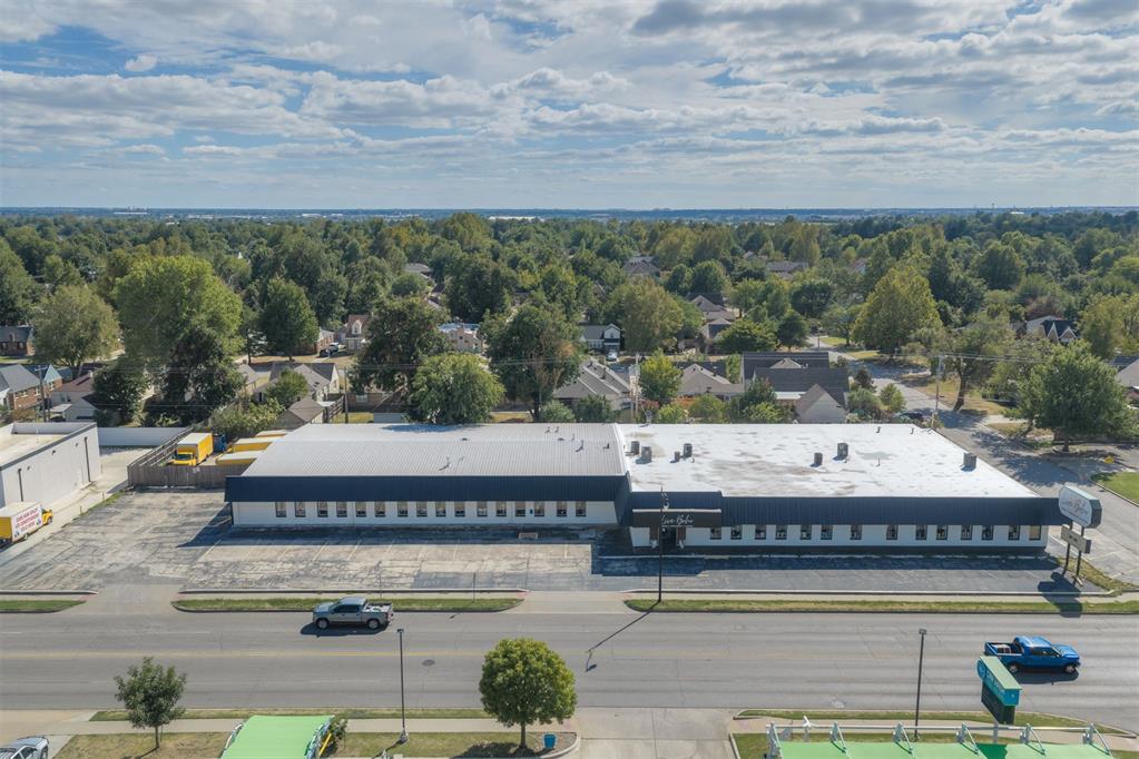 Excellent opportunity to own a substantial 25,600 SF commercial retail/warehouse property located on highly traveled NW 23rd Street. Currently operating as a home decor / furniture store. The property offers exceptional visibility, convenient access and generous parking. The building has undergone significant improvements including a brand-new 336K TPO roof eight 8 HVAC units, updated plumbing a completely remodeled kitchen with appliances and two remodeled interior bathrooms. The versatile floor plan includes 3 private interior offices, plus a warehouse office, extensive showroom space, warehouse/storage areas, 3 overhead doors for warehouse access, a double-door front entrance with vestibule and built-in front counter with shelving.  The property includes 2 interior restrooms plus a separate warehouse restroom. The warehouse provides excellent functionality with 3 overhead doors for convenient loading and access. Additional improvements include new rear fencing and a large illuminated street-facing sign with dedicated electric providing outstanding visibility along NW 23rd Street. With major building systems recently improved, excellent visibility functional warehouse access and a prominent location along NW 23rd Street this space presents an outstanding opportunity for an owner-user or investor seeking a substantial commercial property in OKC