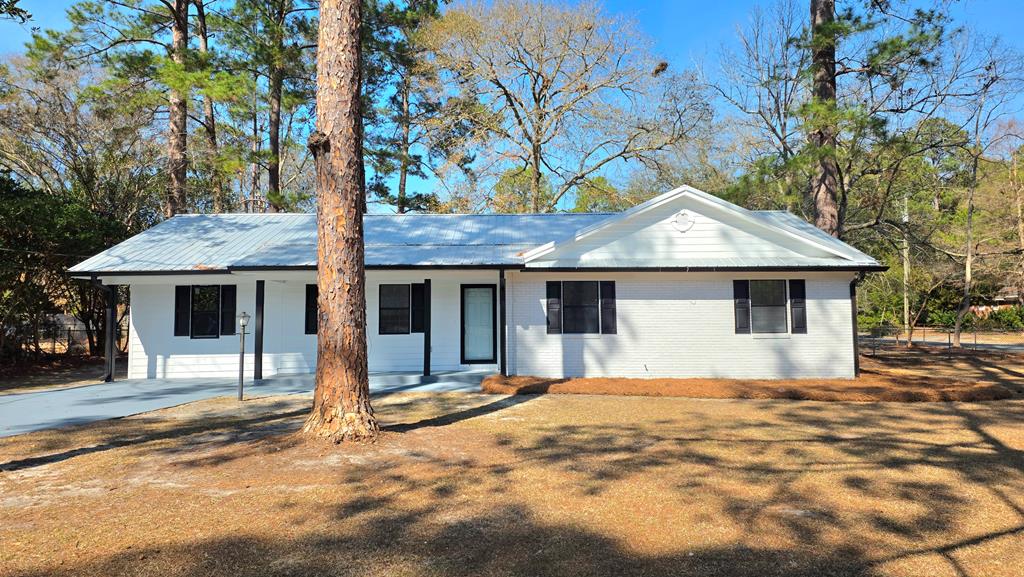 Your dream home is just a phone call away. This 4-bedroom, 2-bathroom residence has been renovated from top to bottom, offering modern elegance and comfort in a well-established neighborhood. Step inside to discover a light & airy floor plan that seamlessly combines style and functionality. The kitchen boasts brand-new stainless steel appliances, granite countertops, and updated cabinetry.  Luxury vinyl plank floors flow throughout the living spaces, leading you into a spacious living room filled with natural light. Step outside to your fully fenced backyard that's perfect for entertaining family and friends or simply unwinding after a long day. This  acre outdoor space is truly an extension of the home. Conveniently located close to local schools, parks, shopping centers, and dining options. Don't miss your chance to own this home—schedule your tour today!