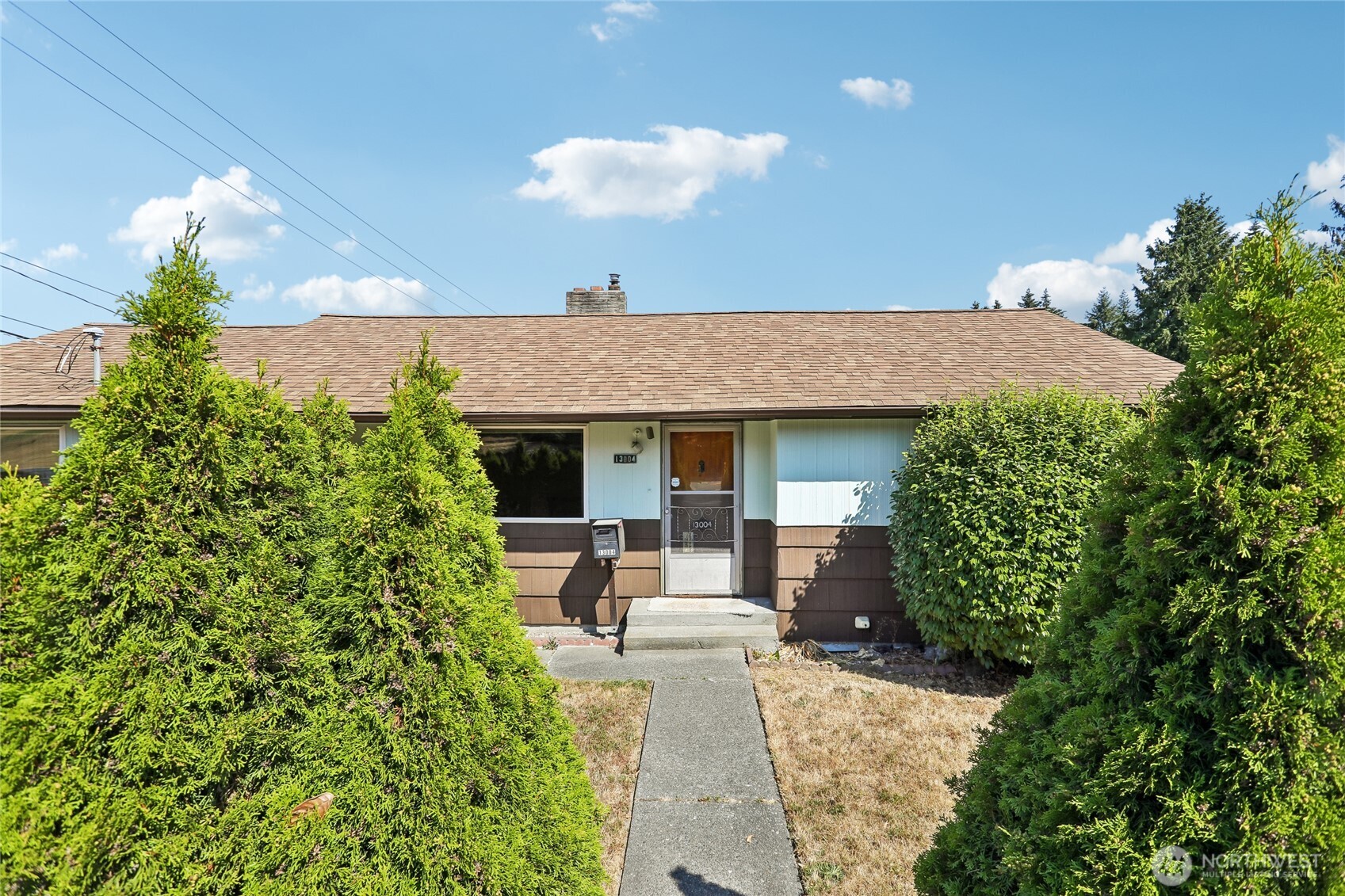 Welcome to 13004 Ambaum Blvd SW, a spacious 4-bedroom, 2-bath home offering 2,680 square feet on a 7,942-square-foot corner lot. The main level features three bedrooms and a generous living area, while the lower level includes a fourth non-conforming bedroom and a large bonus living room, providing flexible space for a variety of needs. Outside, enjoy the yard with garden space, off-street parking, and a detached two-car garage with an oversized shop area for projects, storage, or hobbies. Bring your vision and explore the possibilities, whether you are looking to make cosmetic updates to the existing home or investigate potential development opportunities, including townhomes or a detached accessory dwelling unit (DADU). Buyers to verify zoning MU1, feasibility, permitting, and all development requirements with the appropriate agencies. Conveniently located near shopping, restaurants, local parks, schools, and Seattle-Tacoma International Airport, this property offers a great opportunity to create a home that fits your vision. Mortgage savings may be available for buyers of this listing.