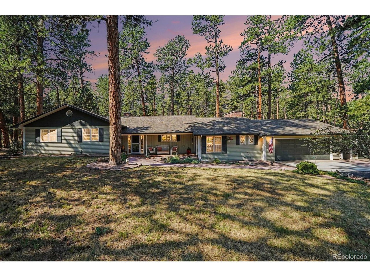 A truly move-in-ready home nestled on a spacious, beautifully maintained lot in the heart of Perry Park. Pride of ownership is evident throughout, and the thoughtfully designed layout offers the comfort and feel of ranch-style living with only a few steps between levels. The main level features a beautifully updated kitchen with granite countertops, a gas range and real hardwood floors. The spacious living room is warm and inviting with a wood-burning fireplace, while the adjoining dining area provides plenty of room for everyday meals and entertaining. Just a few steps up, you'll find two additional bedrooms, a full bathroom and the private primary suite featuring an updated 3/4 bathroom. The lower level offers a generous family room with a working wood stove, half bathroom and laundry area, along with direct access to the incredible backyard retreat. The recently updated basement adds exceptional flexibility with an egress window, refrigerator, sink and kitchenette space-ideal for guests, a mother-in-law suite or multigenerational living. Outside is where this property truly shines. Spend countless days and evenings relaxing on the expansive patio while overlooking the pristine, wooded yard and enjoying the peaceful Perry Park setting. The backyard also features a large workshop with electricity, perfect for hobbies, projects, storage or additional workspace. This home beautifully captures the lifestyle Perry Park is known for-peaceful surroundings, mature trees, abundant outdoor space and a true connection to nature. Scenic Highway 105 offers convenient access to Castle Rock (approximately 25 minutes), Colorado Springs (45 minutes), and Denver (under an hour). With spacious lots, preserved forest surroundings, iconic red rock views, and a welcoming small-town feel, including summer Music in the Park and a weekly farmers market, Perry Park offers a lifestyle that blends privacy, recreation, and connection. A special property that is truly a must-see.