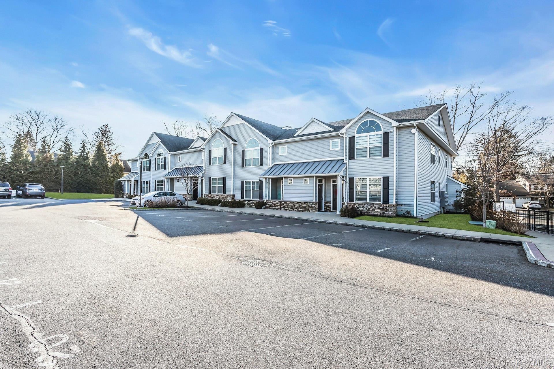 Welcome home to this beautiful & sundrenched 55+ Luxury Condo end unit in the desirable Breton Hills Community in Glen Cove. This unit offers quality workmanship throughout, including well pointed Mill Work & Venetian Plaster. This bright and spacious home offers an open-concept vaulted ceiling living room, kitchen, and dining area, perfect for comfortable everyday living and entertaining. The Primary suite features a private en-suite bathroom, while a second bedroom and hallway bath provide additional space for guests or an office. A full size washer and dryer are conveniently located within the unit, along with a utility room and storage area for extra convenience. This Community has a beautiful vaulted ceiling Club House with Fireplace, Kitchen and Fitness Room. Stone patio and gas barbeques provide a lovely outdoor area. This active community gathers for Social activities including; Bocci, Cards & Dinners. There’s also plenty of parking and a separate garbage area for residents. This is a rare opportunity to own a modern, move-in ready condo in a secure, gated community that offers comfort, convenience, and community.Be a part of this active 55+ Gated community, centrally located to all the best the North Shore has to offer, including; Morgan Park, Prybil Beach, Glen Cove Golf Course and miles of waterfront.