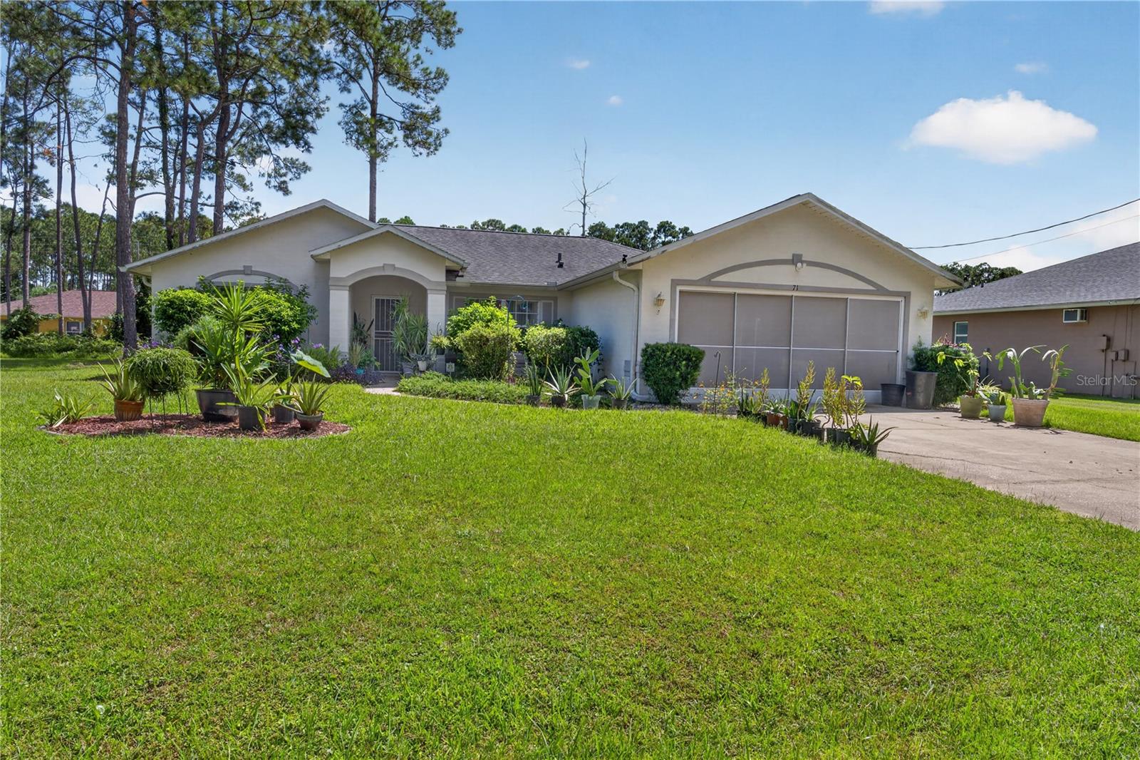 Welcome home to 71 Richmond Dr! This 3-bedroom, 2-bathroom home features a split floor plan, screened porch, and a spacious layout. Step inside and you will be greeted by a bright and inviting living space with vaulted ceilings, a separate dining area, and breakfast nook. Even better, you’ll find easy-care laminate and tile flooring throughout - no carpet! The kitchen features stainless steel appliances, while the primary suite includes a large walk-in closet and private bathroom with dual sinks. An interior laundry room and two-car garage offer added convenience, while the screened porch provides a relaxing spot to enjoy the spacious backyard and natural surroundings. Currently tenant occupied on a month-to-month lease, the property is ready for its next chapter, whether as an investment or a place to call home.