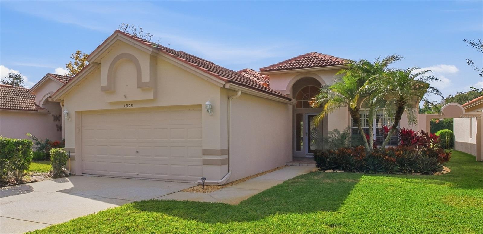 Stunning Stratford Model Villa on the Golf Course with Pool – Crescent Oaks Country ClubWelcome to this impeccably maintained Stratford model villa located in the highly sought-after, gated Crescent Oaks Country Club. Perfectly positioned on the golf course, this 3-bedroom, 2-bathroom villa offers serene views, privacy, and true Florida living at its finest. The home is beautifully adorned with crown molding and tall baseboards throughout, adding a refined architectural touch.Step inside to discover a light-filled, open floor plan designed for both comfort and entertaining. The spacious kitchen has been tastefully updated with quartz countertops, a decorative tile backsplash, ample cabinetry, a large pantry, and generous counter space, all flowing seamlessly into the dining and living areas. The primary suite is a peaceful retreat featuring an en-suite bathroom and generous closet space, while two additional bedrooms provide flexibility for guests, a home office, or hobby space. An oversized laundry room includes a dedicated office nook with a window, perfect for working from home.Enjoy year-round outdoor living from the screened lanai with an in-ground pool, overlooking lush fairway and water views—ideal for both relaxing and entertaining. The lanai also features a fully equipped outdoor kitchen with sink, glass cooktop, counters, and cabinetry, along with an automatic retractable awning for added shade and comfort. This home has been meticulously cared for and reflects pride of ownership throughout.Crescent Oaks Country Club is a premier community known for its mature landscaping, championship golf course, clubhouse, tennis and pickleball courts, and optional golf memberships. The community is ideally located within an approximate 30-minute drive to both Tampa International Airport (TPA) and St. Pete–Clearwater International Airport (PIE), as well as beautiful Gulf beaches and the world-famous Tarpon Springs Sponge Docks.Maintenance-free living, breathtaking golf course views, and a private pool—this exceptional villa truly has it all.Don’t wait to schedule your showing—this villa is sure to sell quickly!