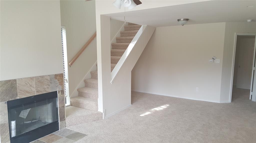 Set within the Richland Trace community, this two-level condo is not only a comfortable home but also a great investment opportunity. Currently tenant-occupied, it generates $1,400 per month in rental income, with a lease secured through October.

The main level features an open living and dining area with a cozy fireplace and direct access to a covered patio. The primary bedroom is located downstairs, paired with a full bath for ease and functionality. The kitchen includes a full suite of appliances—refrigerator, electric range, oven, microwave, and dishwasher—along with ample cabinet storage. Upstairs, a second bedroom enjoys privacy with its own bath and dual sinks.

Practical details include central heating and air, ceiling fans, stacked washer and dryer connections, and assigned covered parking. HOA dues cover water, sewer, trash, and front yard maintenance, simplifying daily living.

The community offers easy access to Richland College, Texas Instruments, and the Telecom Corridor, with nearby shopping and dining at Richardson Square, Galleria Dallas, and Lake Highlands Town Center. Outdoor enthusiasts will appreciate proximity to White Rock Creek Trail and Lake Highlands parks, while commuters benefit from quick connections to 635, 75, and the DART rail.