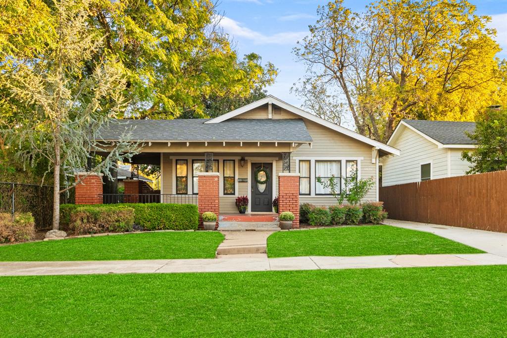 A Century of Charm, Character & Modern ComfortStep onto the charming front porch of this beautiful 1918 Craftsman, where timeless character and thoughtful updates come together to create a truly special home. Inside, beautiful wood floors and exquisite woodwork showcase the craftsmanship of a bygone era, while updated bathrooms and custom closets bring modern comfort and convenience to everyday living.The property also offers exceptional versatility with a separate back unit that has been rented as a studio. Complete with a full kitchen and an updated bathroom featuring a walk-in shower, this private space offers endless possibilities as a rental, guest suite, home office, or creative studio.Outside, the backyard is a peaceful retreat, highlighted by a magnificent magnolia tree, established landscaping, and plenty of room to create a garden of your own. A garage, currently used primarily for storage, provides additional flexibility and valuable space.With its inviting front porch, original architectural details, warm wood finishes, beautifully landscaped grounds, and versatile additional living space, this one-of-a-kind Craftsman offers the rare opportunity to enjoy the charm of a historic home with the comforts and conveniences of today. Full of character, possibilities, and enduring appeal, this is a home ready to be loved for generations to come.Main Home: 1,561 SF (2 bedroom/2 bathroom)Studio: 740 SF (studio/1 bathroom/mini split)Detached Garage: 216 SF