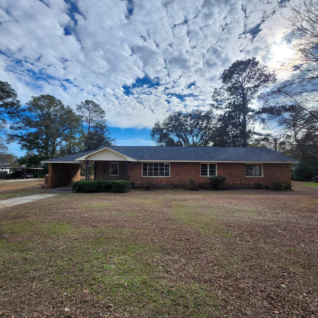Sprawling brick home located in the heart of Camilla! Boasting 2,596 sq ft of living space, this residence features 2 bathrooms, and 4 bedrooms, including a massive primary suite designed for relaxation! Outside, enjoy the convenience of 2 separate carports offering covered parking and easy access to home! With its solid brick construction, this home promises lasting quality and classic style! Call today for a showing. Seller is a licensed real estate broker in the state of GA. Sold as is.