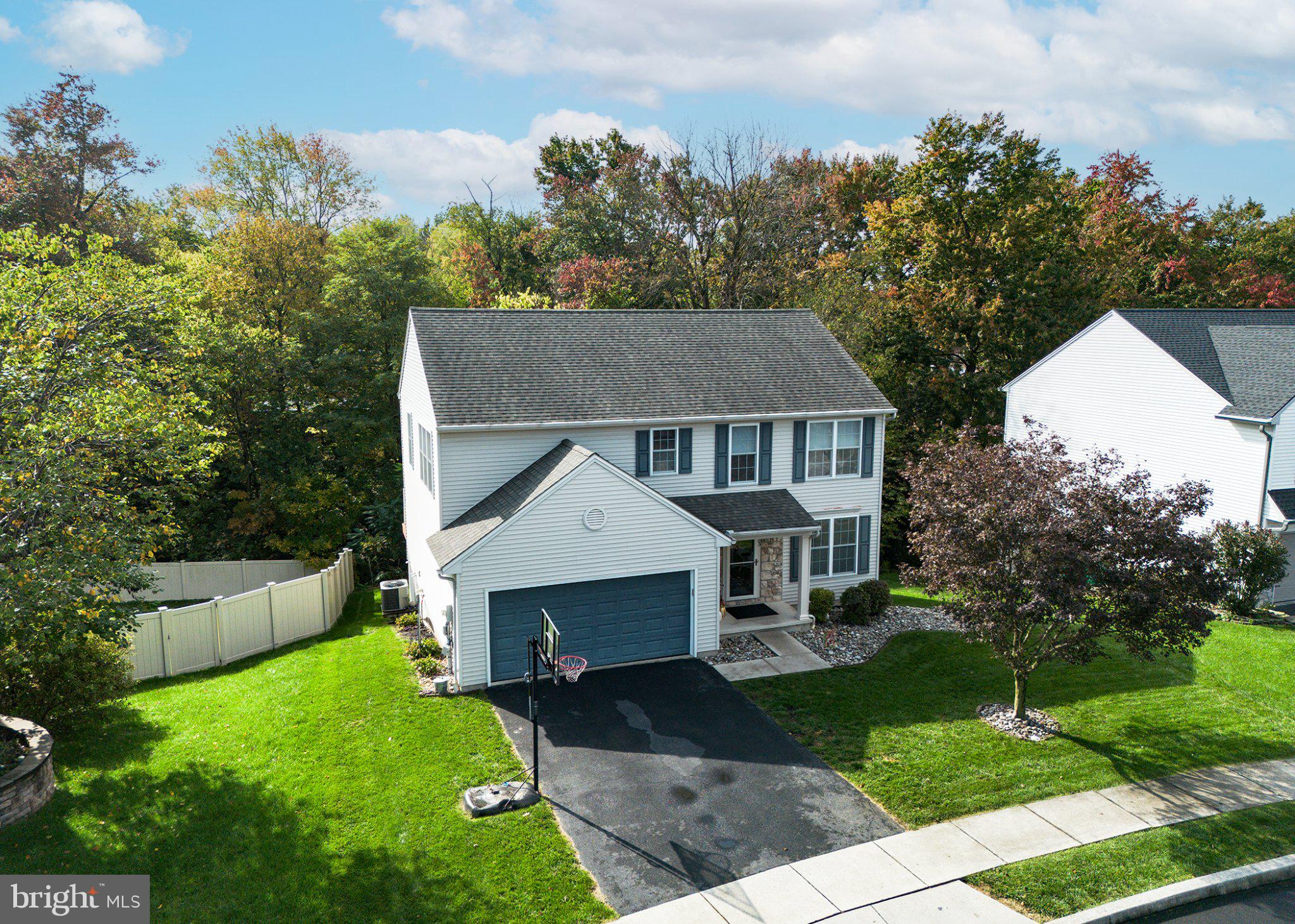 Welcome to 205 Edenderry Way in Enola, where space, comfort, and flexibility come together to create the perfect place to call home! Featuring four bedrooms, two full baths, and two half baths, this home offers a thoughtfully designed layout with plenty of room for everyday living, entertaining, and multigenerational needs.As you enter, you'll find a versatile flex space just off the foyer, perfect for a home office, formal dining room, or whatever best suits your lifestyle, along with a convenient half bath. The open-concept family room and kitchen create a welcoming gathering space, with the kitchen featuring granite countertops, a center island, stainless steel appliances, and a generously sized pantry. A conveniently located laundry room just off the kitchen provides easy access to the oversized garage, adding even more functionality to your daily routine.Upstairs, you'll discover a spacious loft-style family room with beautiful hardwood floors, offering the perfect spot for a second living area, playroom, or relaxation space. The second-floor hallway includes a full bathroom, while the primary bedroom suite provides a private retreat complete with a walk-in closet and an en-suite bath featuring double vanities, a tub, and a separate shower. Two of the home's bedrooms feature walk-in closets, providing excellent storage and organization.The possibilities continue in the full walkout basement, currently being used as an in-law suite. Complete with an additional bedroom and half bath, this lower-level space offers wonderful potential for multigenerational living, extended guests, or a private retreat with direct outdoor access.Step outside from the kitchen onto the composite deck, where privacy fencing creates a comfortable setting for relaxing or entertaining. Stairs lead down to the yard, and a handy storage shed tucked beneath the deck provides extra space for outdoor essentials. Additional features include electric fencing for an animal, natural gas, and economical natural gas heating and hot water.Conveniently located with easy access to Routes 581, 81, 83, and 15, you'll appreciate the accessibility to shopping, dining, and amenities throughout both the East and West Shores.With generous living space, a flexible floor plan, and exciting possibilities for multigenerational living, this home is ready for its next chapter. Don't delay—make 205 Edenderry Way your own today!