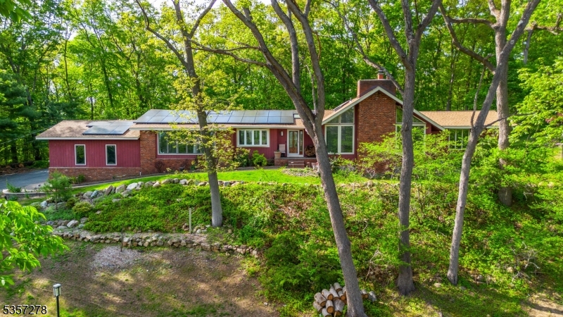 Beautiful Contemporay Ranch set on a knoll with breathtaking views of Blackriver wildlife management and mountain Ridge..Perfect private retreat level back yard with in ground pool and patios w/ exotic plant varieties. This home has been updated with newer open kitchen design and baths, New flooring.. High ceiings thruout Vaulted in the sunkin living/great room with Brick fireplace The list of newer updates are enless New septic system, well water purification system,Roof, whole house generator, leased cost effeicent Solar panel system. This spacious Home has it all for easy one floor living with all the modern conviences This is a not to be missed home.