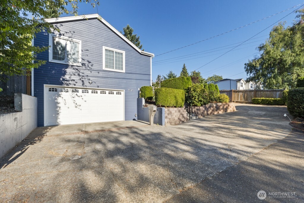 4 bed & 3 bath rambler with two primary suites, and a permitted mother-in-law apartment with 1 bed & 3/4 bath, fully equipped with a gas stove, refrigerator, dishwasher, microwave and washer/dryer. Nicely remodeled Mercer Island home with cherry kitchen cabinet, granite slab countertop throughout. SS appliances that include a new gas stove. Hardwood flooring in most bedrooms and living & dining rooms. Primary suite with a walk-in closet and a double-sided gas fireplace shared with adjoining family room. Cathedral ceiling, skylights & extensive windows give plenty of natural light. Extensive decking. Low maintenance yard. Lots of off-street parking. A/C. Easy access to I-90. Walking distance to schools and parks. Bus stop nearby.