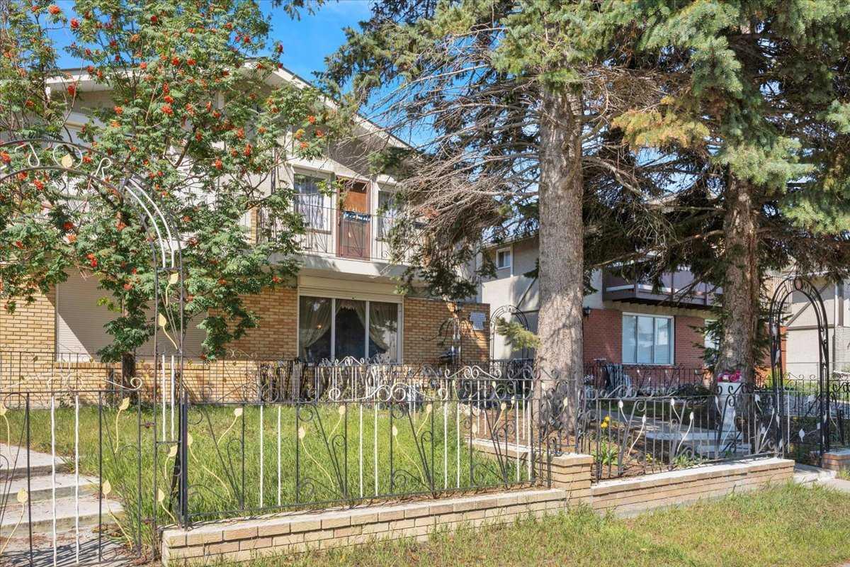Tremendous opportunity in Forest Lawn! This two-storey attached home offers 3 bedrooms upstairs and plenty of potential for the buyer looking to renovate and create something of their own. The main floor features a spacious living room, kitchen with adjoining dining area, and sliding doors leading to the rear patio. Upstairs, the primary bedroom includes a private balcony, walk-in closet, and convenient access door to the main bathroom, along with two additional bedrooms. The developed basement provides additional living space with a family room, flex room, and summer kitchen (plumbing for sink out of order). Please note there is no separate exterior entrance to the basement. Outside, enjoy a fully landscaped yard with concrete patios at the front and rear, plus a vegetable garden. A single detached garage and back alley provide convenient parking and access. Ideally located close to International Avenue, schools, transit, shopping, restaurants, and major routes for easy access throughout Calgary. This home is in original condition and requires updating, offering an excellent opportunity for renovators, investors, or buyers looking to add value. Property is being sold in "as-is" condition.