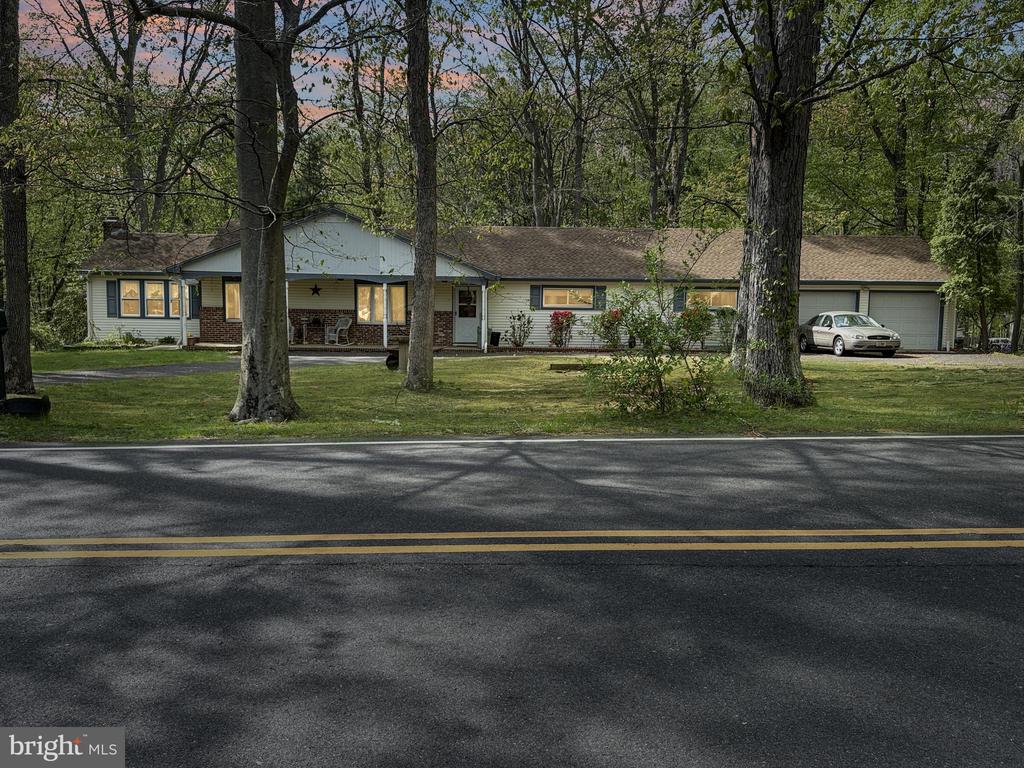 Welcome to this spacious 4-bedroom, 2.5-bath home offering 2,156 square feet of living space, perfectly situated on a generous .92-acre lot. With a full basement and a 2-car garage, this property provides plenty of room for storage, hobbies, and future expansion.This home is ready for its next owner to bring their vision and make it truly their own. Major updates include a brand new oil burner (2026), offering peace of mind for years to come. The home also features central air conditioning, ensuring comfort throughout the seasons.Step outside to enjoy the expansive backyard, complete with a 14x14 deck—perfect for entertaining, relaxing, or enjoying the serene surroundings. The circular driveway adds both convenience and curb appeal, providing ample parking for guests.With its solid structure, desirable features, and nearly an acre of land, this property presents an excellent opportunity to create your dream home in a beautiful setting.Don’t miss the chance to unlock the full potential of this property!