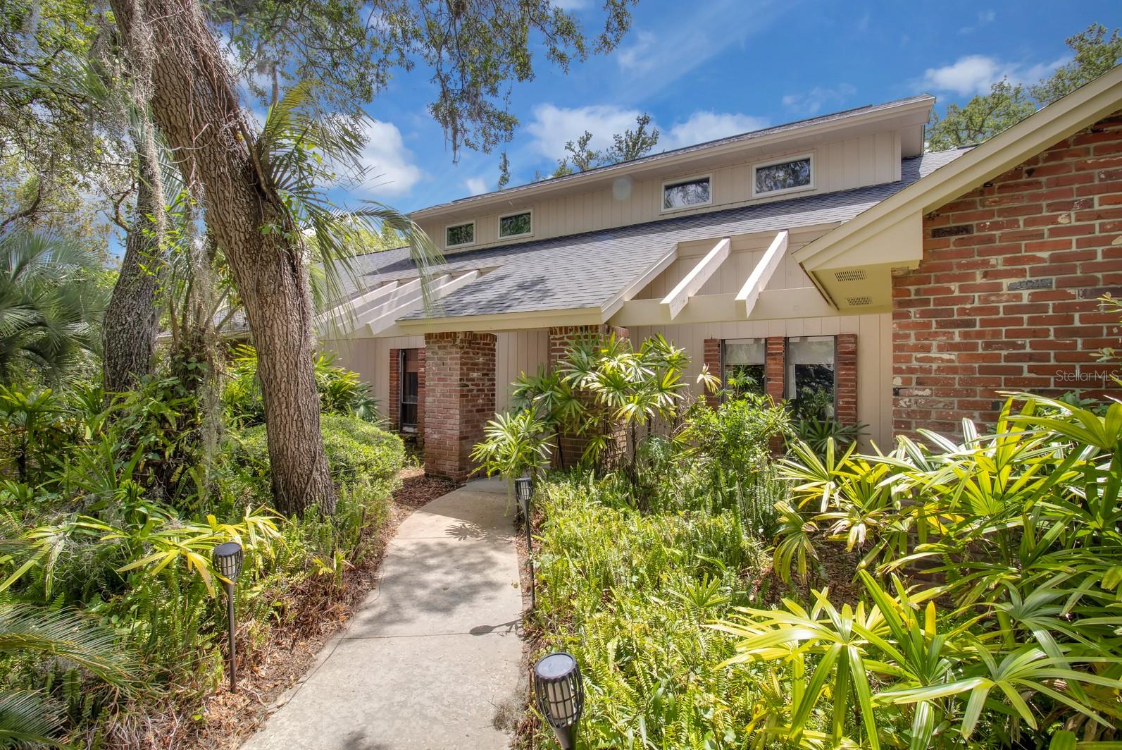 Welcome to this great Sweetwater Oaks home!! This expansive 4 bedroom, 3 and a 1/2 bathroom home has so much to enjoy!! The home is located on a quiet street and surrounded by beautiful tropical landscaping on the private .55 acre low maintenance lot! The interior of this home features split plan bedrooms, 3 full bathrooms, a pool bathroom, a private bathroom shared between two bedrooms(Jack and Jill) a convenient and classy half bathroom, soaring ceilings, an amazing wood burning fireplace in the main room, the spacious home office is private and quiet with French Doors, the room sizes are huge and storage space is abundant! The upstairs loft currently is a great hideaway but could be a game room/office/study/5th bedroom/hobby room/etc!! The kitchen is ready to go with a very nice banquette and built in appliances! The back porch is one of the largest in the community and perfect for relaxing by the giant solar heated lagoon pool or hosting the largest gathering! The side entry garage is oversized and measures 576 square feet, room for cars and toys!! The home was just replumbed, the AC units are newer, the roof was replaced in 2020, the solar pool heating system replaced in 2021. The home is carpet free, low maintenance ceramic tile and laminate flooring makes life easier!!Come home and enjoy all the unique and wonderful Sweetwater Oaks amenities all with low annual HOA dues!! These amenities include access to Sweetwater Beach at Lake Brantley which offers a beautiful park and beach as well as a covered pavilion for gatherings, boating, water skiing, fishing, sailing, kayaking and fun!Eight tennis courts, 8 pickle ball courts, sand volleyball at Sweetwater Beach, many parks, multiple playgrounds, a beautiful community center and many community events for everyone!! Access to the Wekiva River is right down the street at Riverbend Park, enjoy soccer, baseball, kayaking, canoeing, fishing, the picnic and party pavilion, or nature walks and much more! The schools are the best in the area; Sabal Point Elementary School, Rock Lake Middle School and nationally ranked and highly regarded Lake Brantley High School!! The location, quality and condition are right, call today to see this great home!!