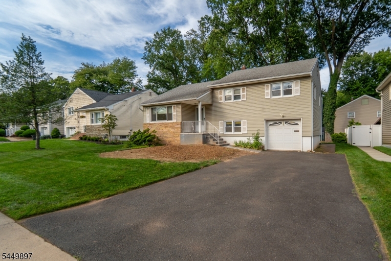 This 3-bedroom, 2.5-bath split-level, located in the highly desirable Walnut/Livingston Elementary School district, is ready for its next owner to make it their own. The welcoming foyer opens up to a spacious sun filled living room and dining room which flows seamlessly into the eat-in kitchen. The ground level features a comfortable family room, convenient half bath, access to the oversized one-car garage, and a rear entrance to the private patio and lovely  backyard. Upstairs, you'll find three generously sized bedrooms, including a primary suite with a private full bath and walk in closet ,plus an additional full bathroom. The basement offers a laundry area and plenty of potential for additional living space. With a flexible floor plan, spacious living areas, and incredible potential, this home presents a wonderful opportunity to renovate, customize, and create your dream home in one of Cranford's most sought-after neighborhoods. Conveniently located near major highways, shopping, dining, and public transportation. Sold as-is. Not in a flood zone.