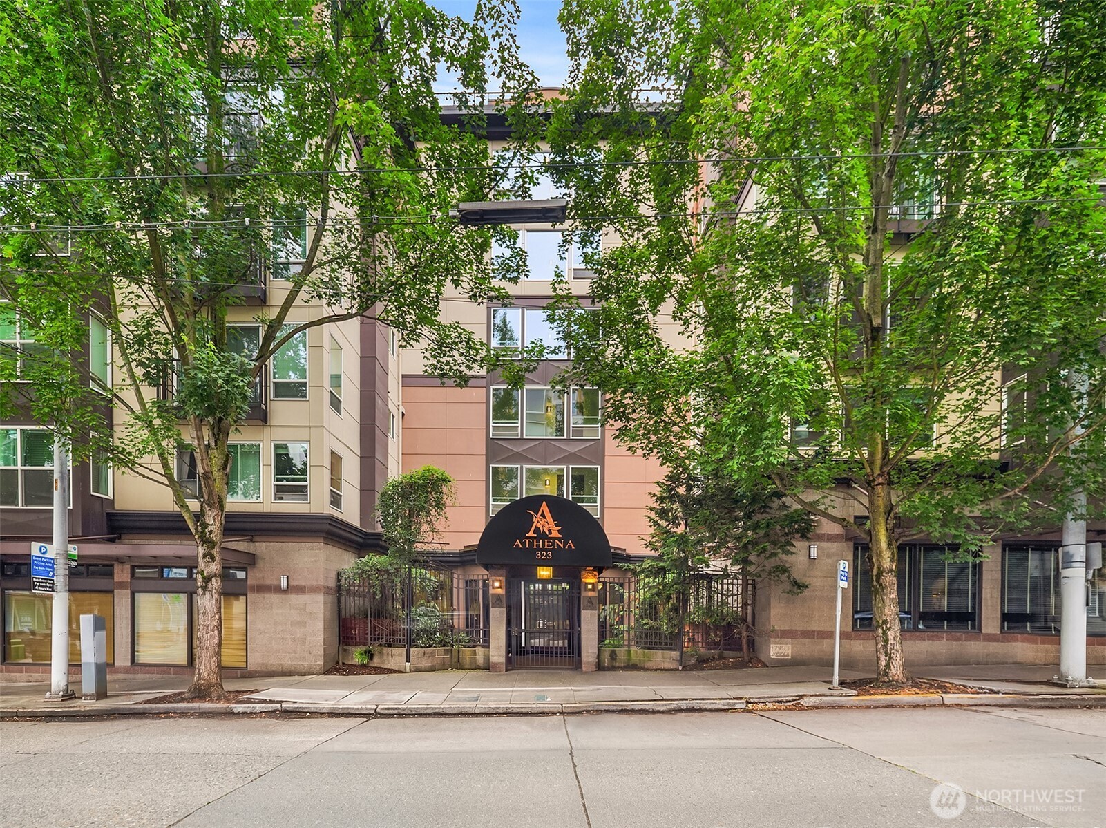 Beautifully updated 1 bedroom + office in The Athena, a secure, gated boutique building in the heart of Lower Queen Anne. A rare opportunity in this building to enjoy an expansive private patio that wraps the unit, extending the living room and den outward for exceptional indoor-outdoor living. The functional layout offers a versatile office space, ideal for remote work or a den. Building amenities include a stunning rooftop deck with 360-degree views of the Olympic Mountains, Puget Sound, and the Seattle skyline, plus 1 secure parking space, a gym, library, and additional common gathering areas throughout the building. No rental cap. Steps to Queen Anne's best shops, restaurants, and nightlife, with easy access to downtown — this is urban living at its finest.
